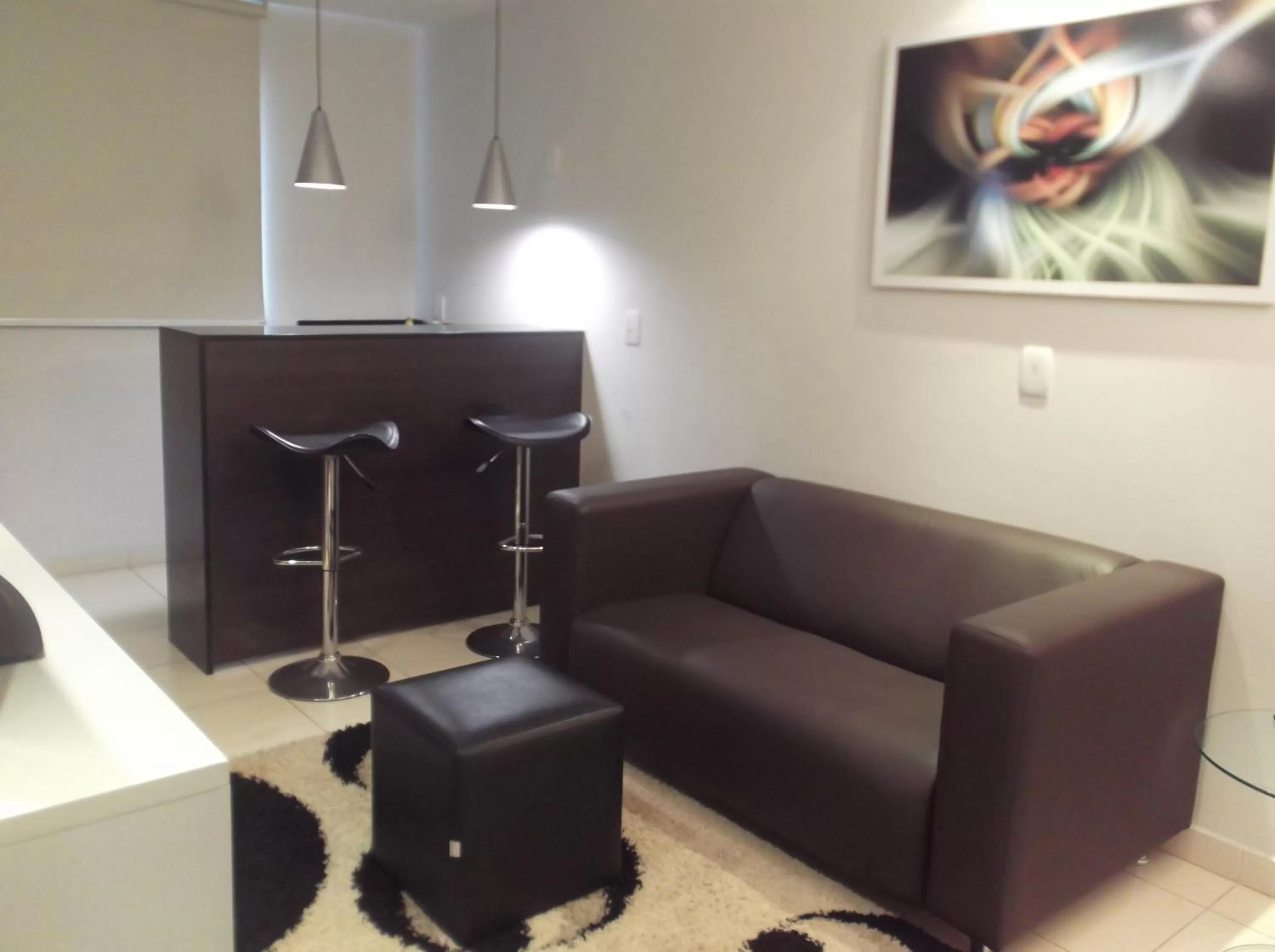 Communal lounge/ TV room in Atrium Confort Hotels