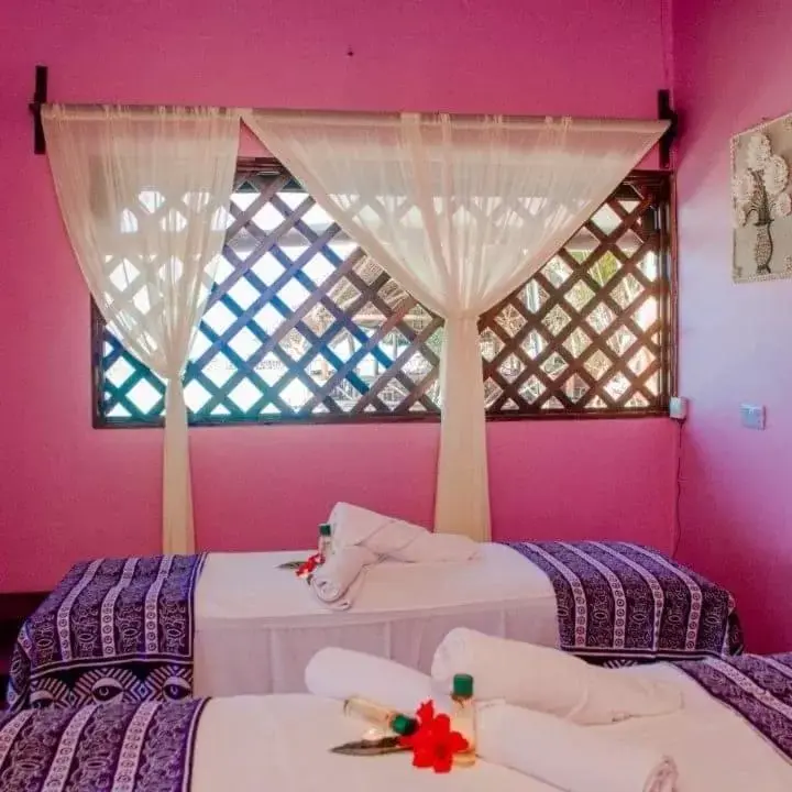 Bed in Mnarani Beach Cottages