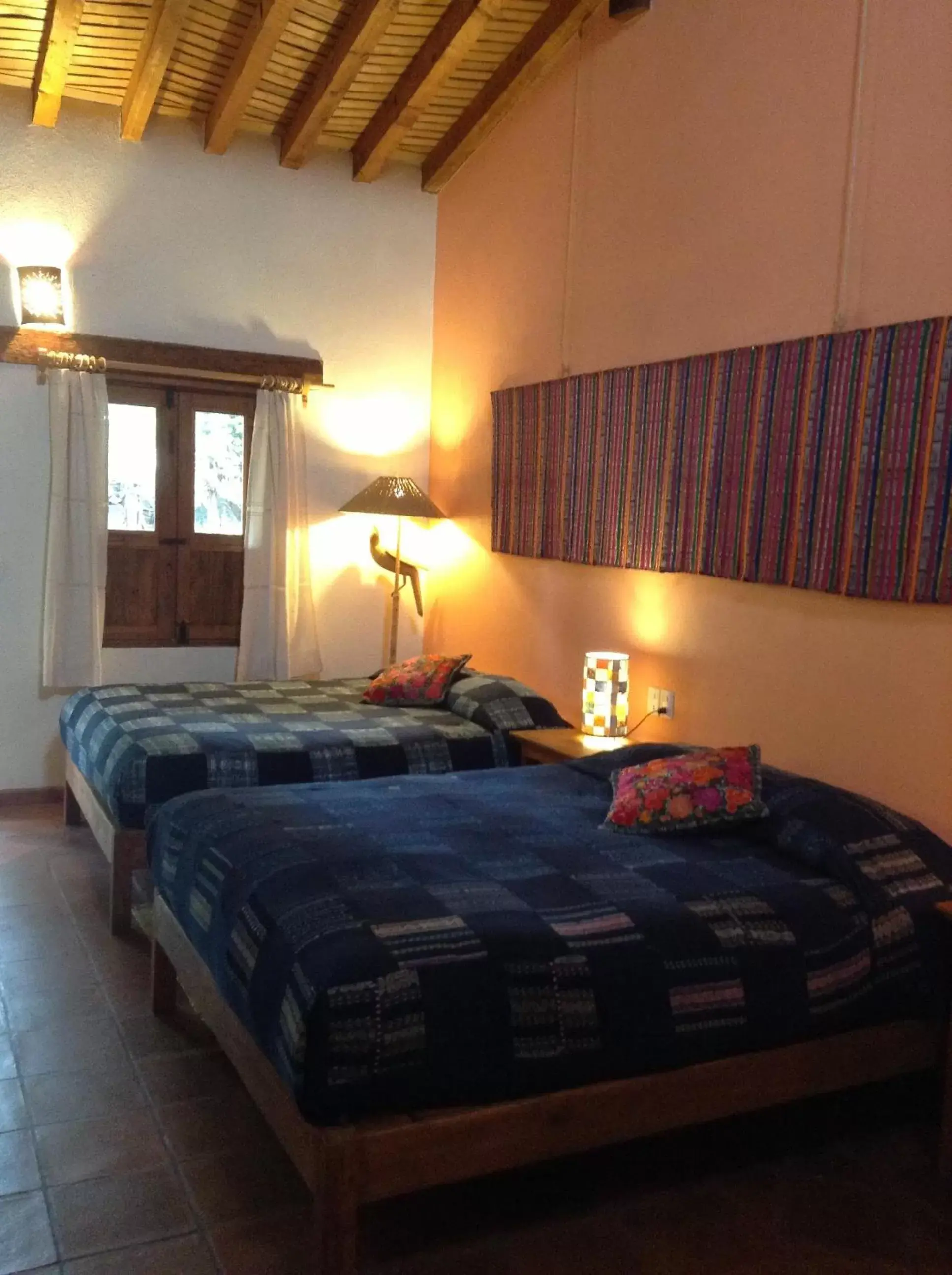 Photo of the whole room, Bed in Posada Yolihuani