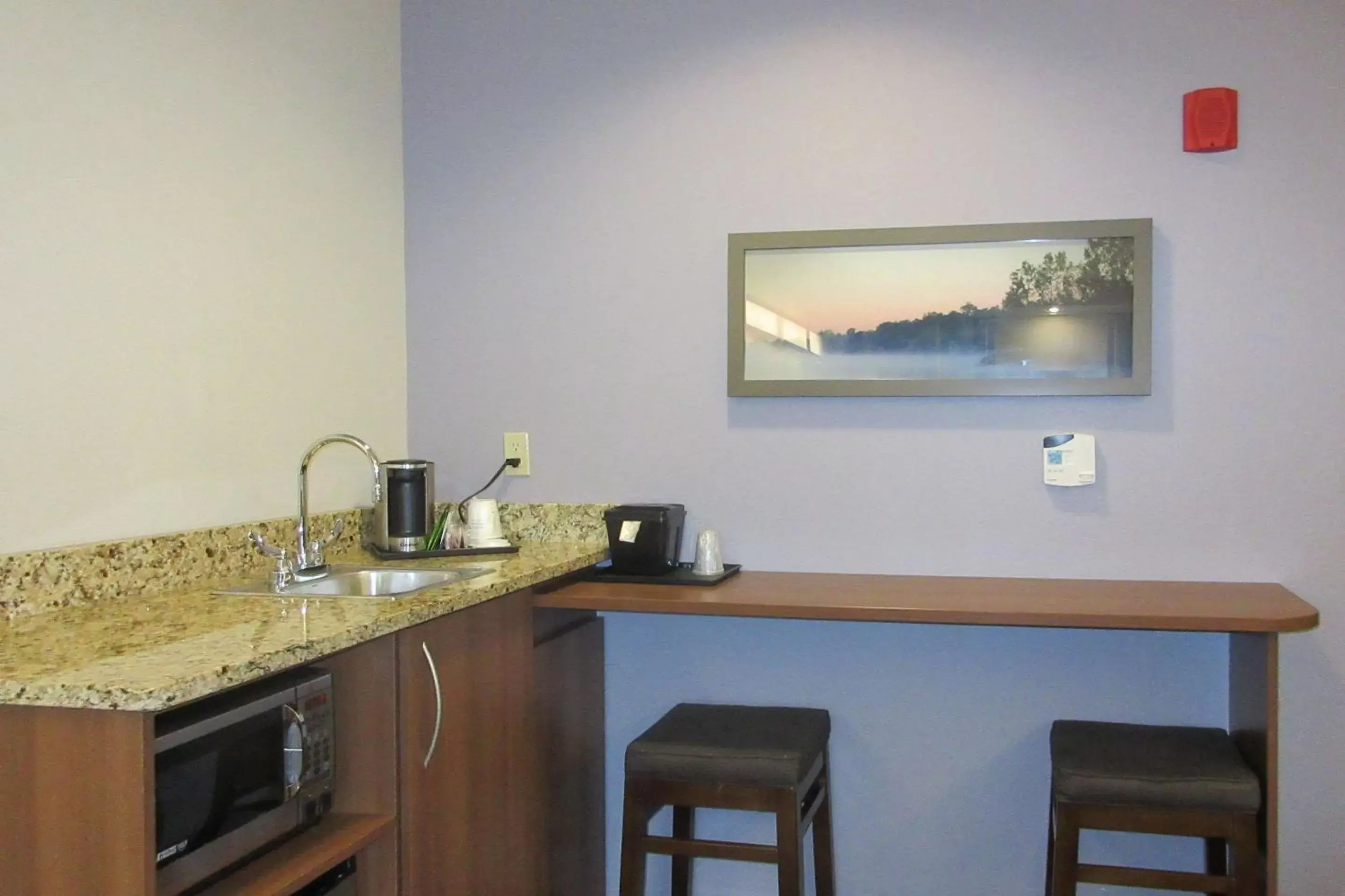 Photo of the whole room, Kitchen/Kitchenette in Quality Inn & Suites