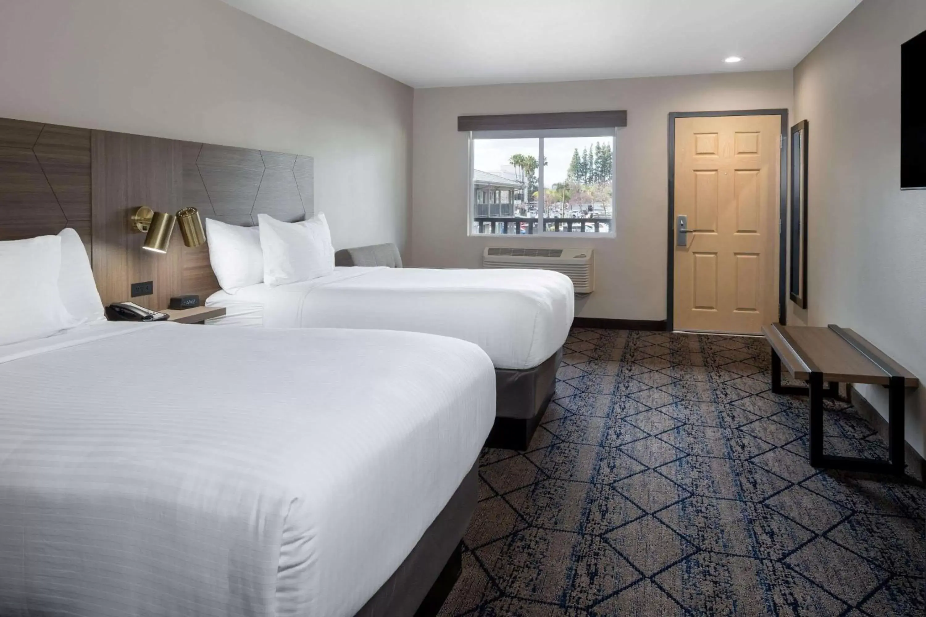 Photo of the whole room, Bed in Ramada by Wyndham Modesto Yosemite Area