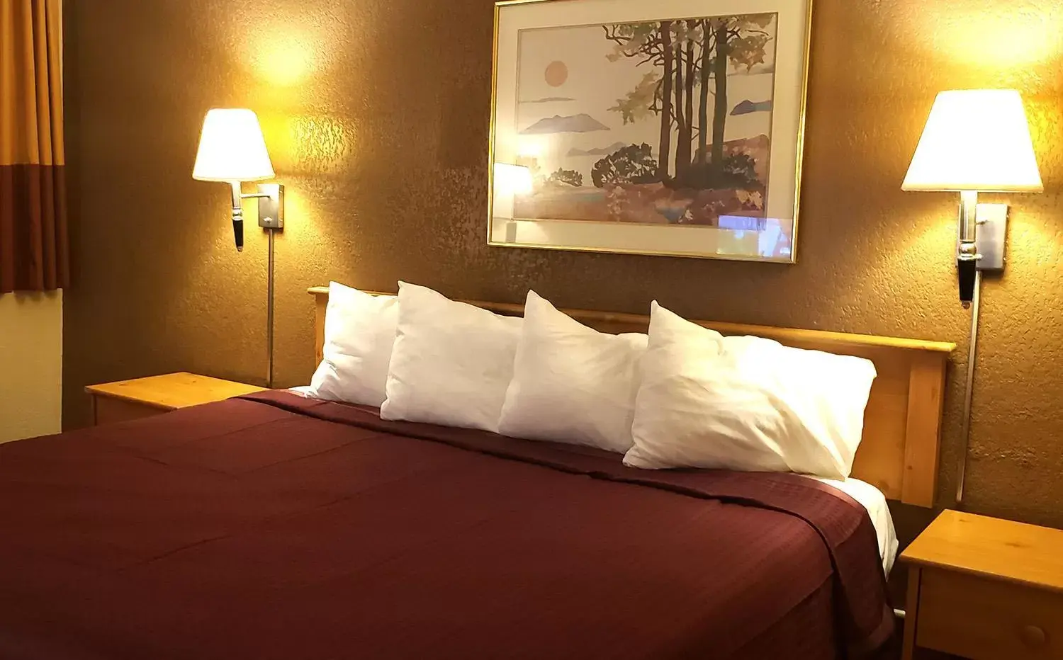 Bed in Coratel Inn & Suites by Jasper Mankato