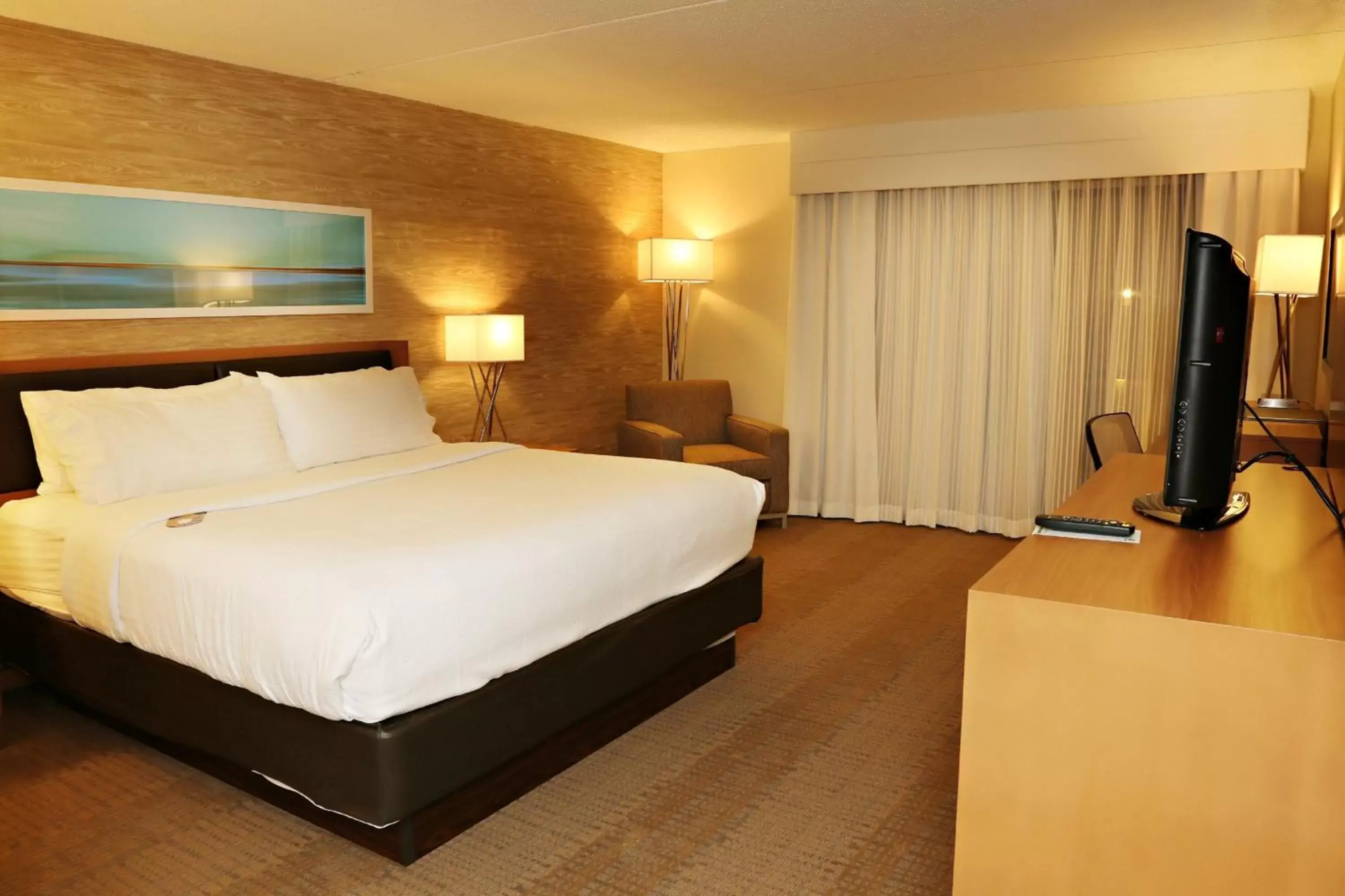 Photo of the whole room, Bed in enVision Hotel & Conference Center Mansfield-Foxboro