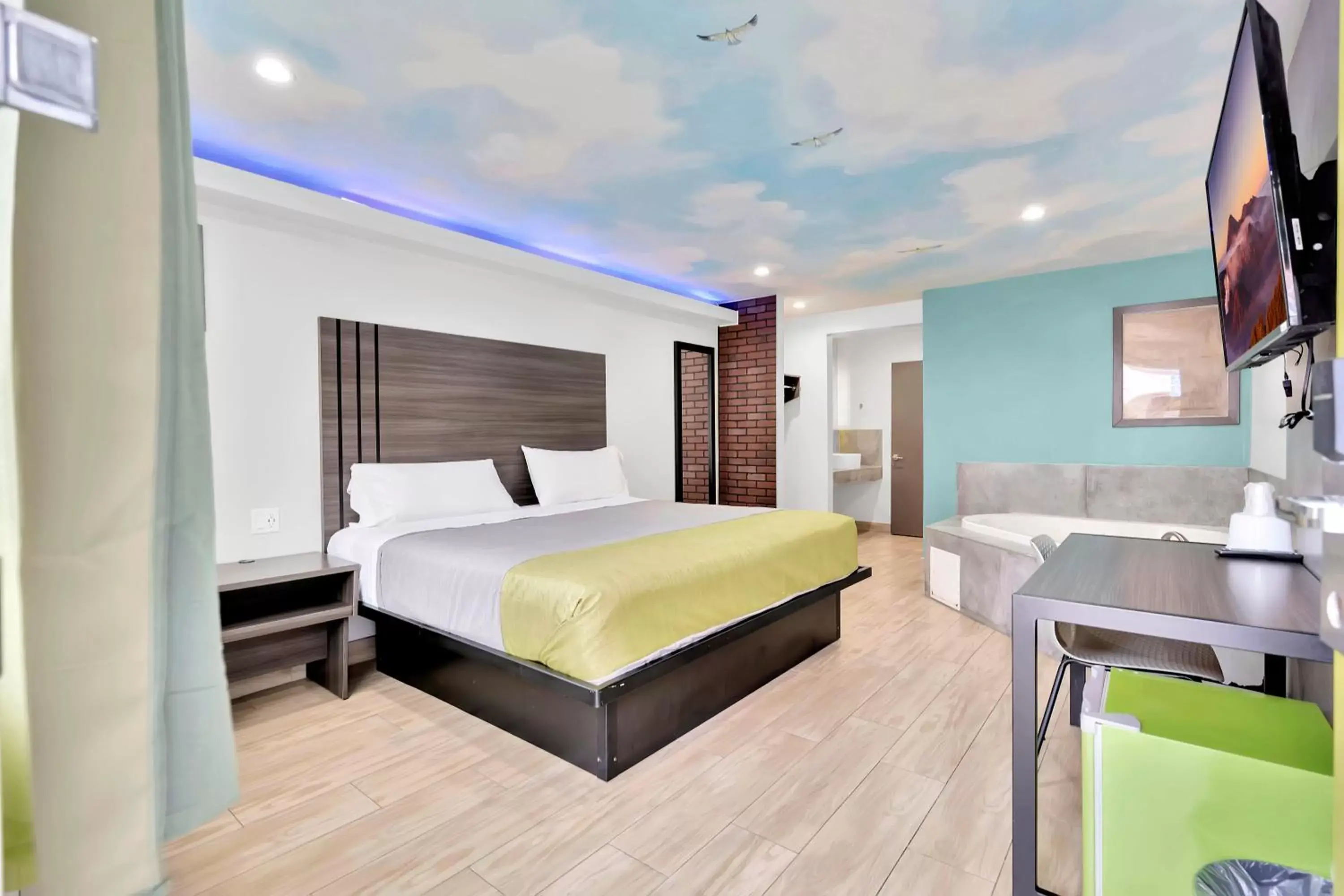 Bed in Exclusivo Inn and Suites