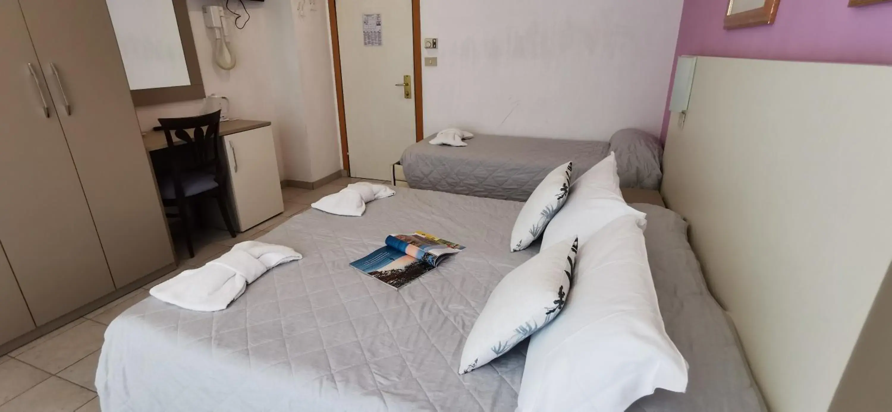 Photo of the whole room, Bed in Aura Living Hotel