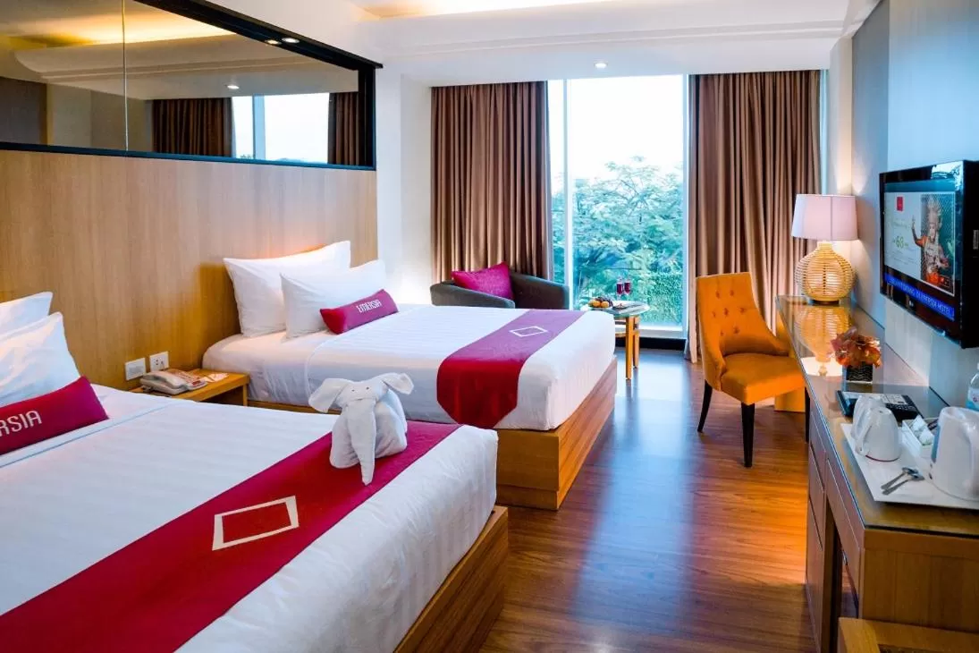 Bed in Emersia Hotel and Resort