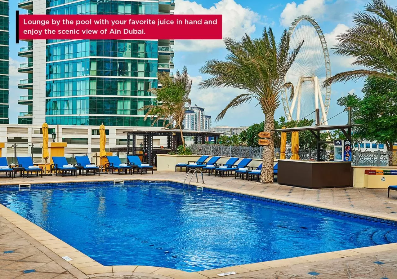 Swimming pool in Ramada Hotel, Suites and Apartments by Wyndham Dubai JBR