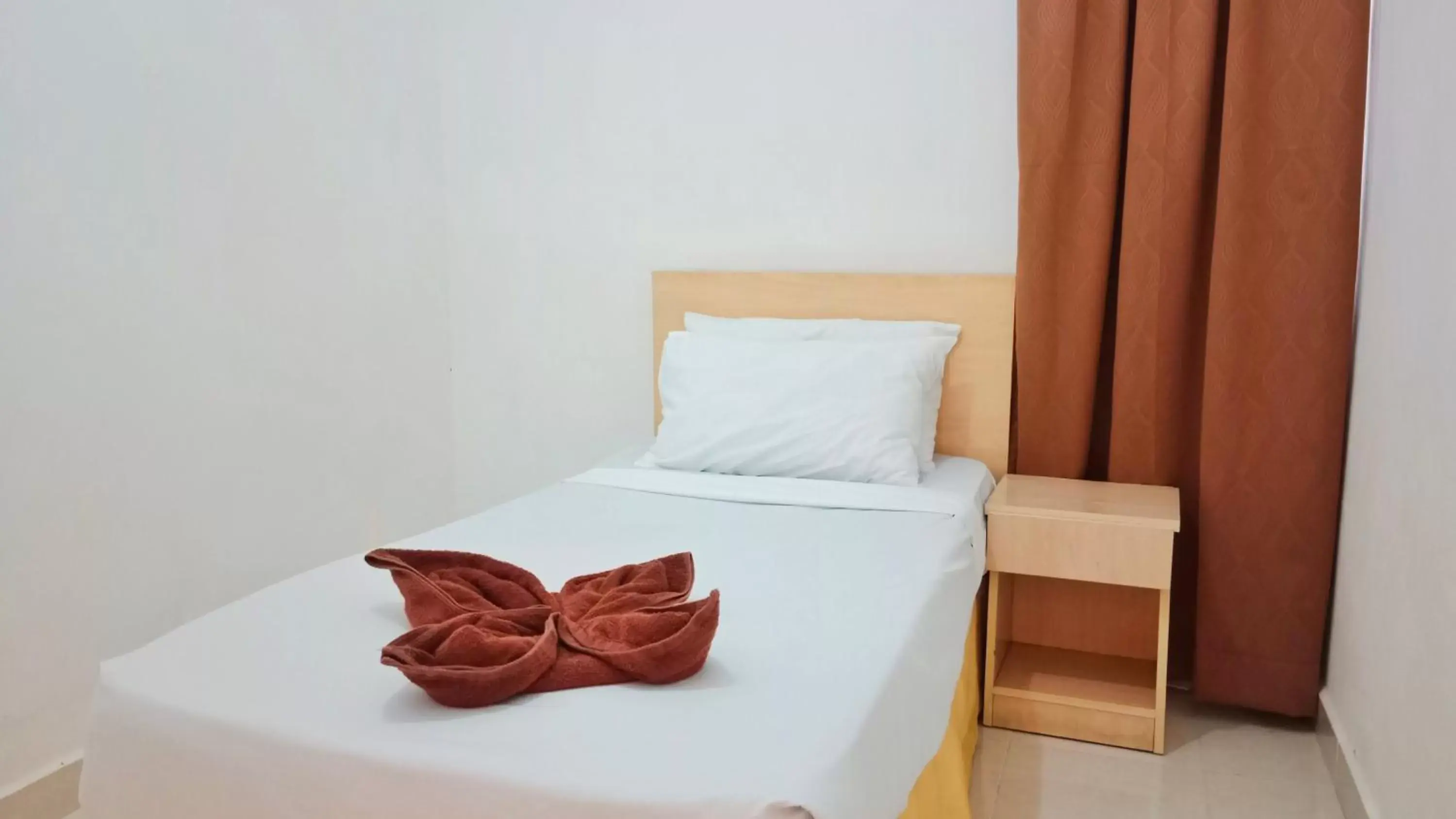 Bed in Sumai Hotel Apartment