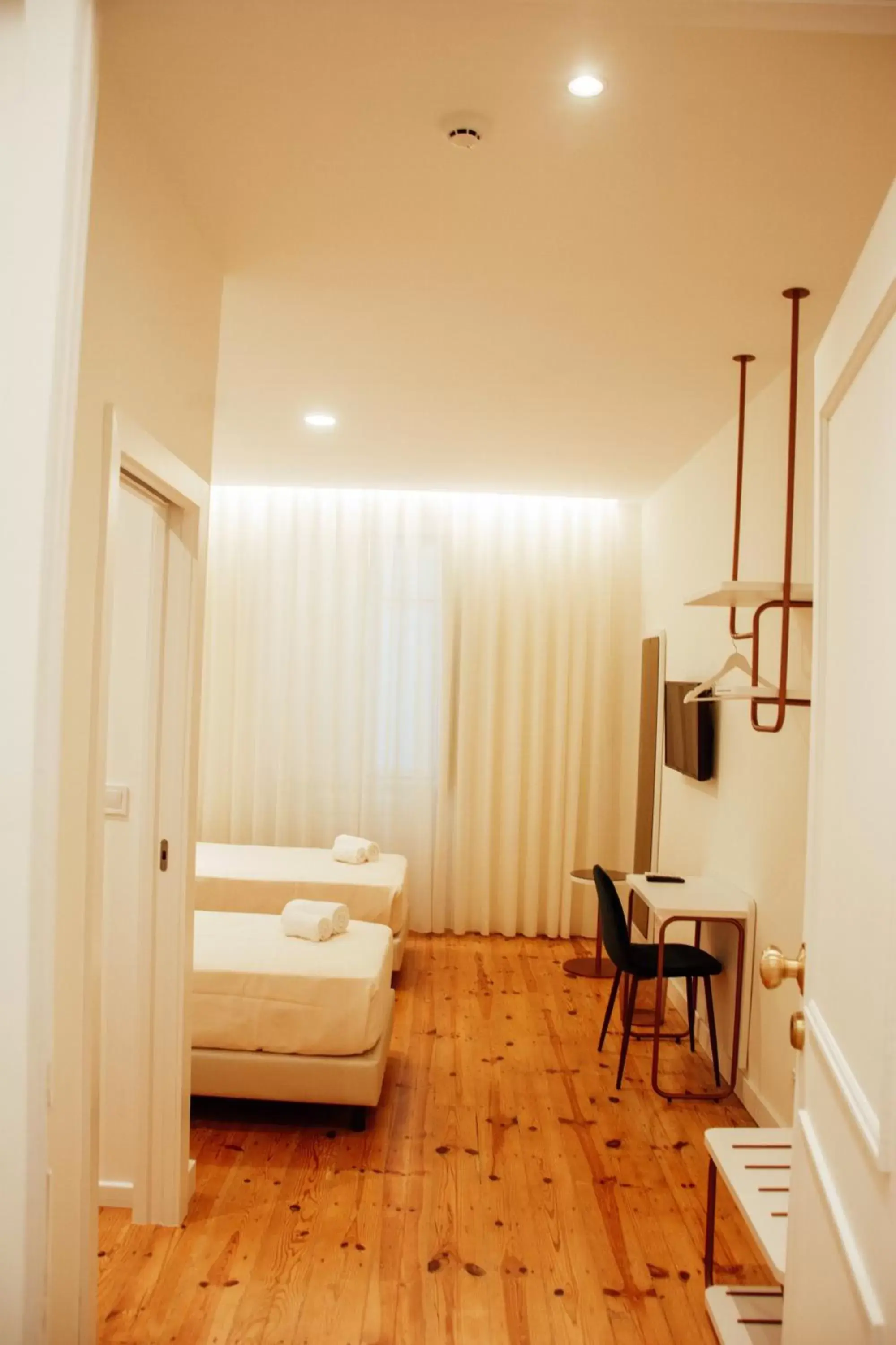 Bedroom in Le Premier Lisbon Suites