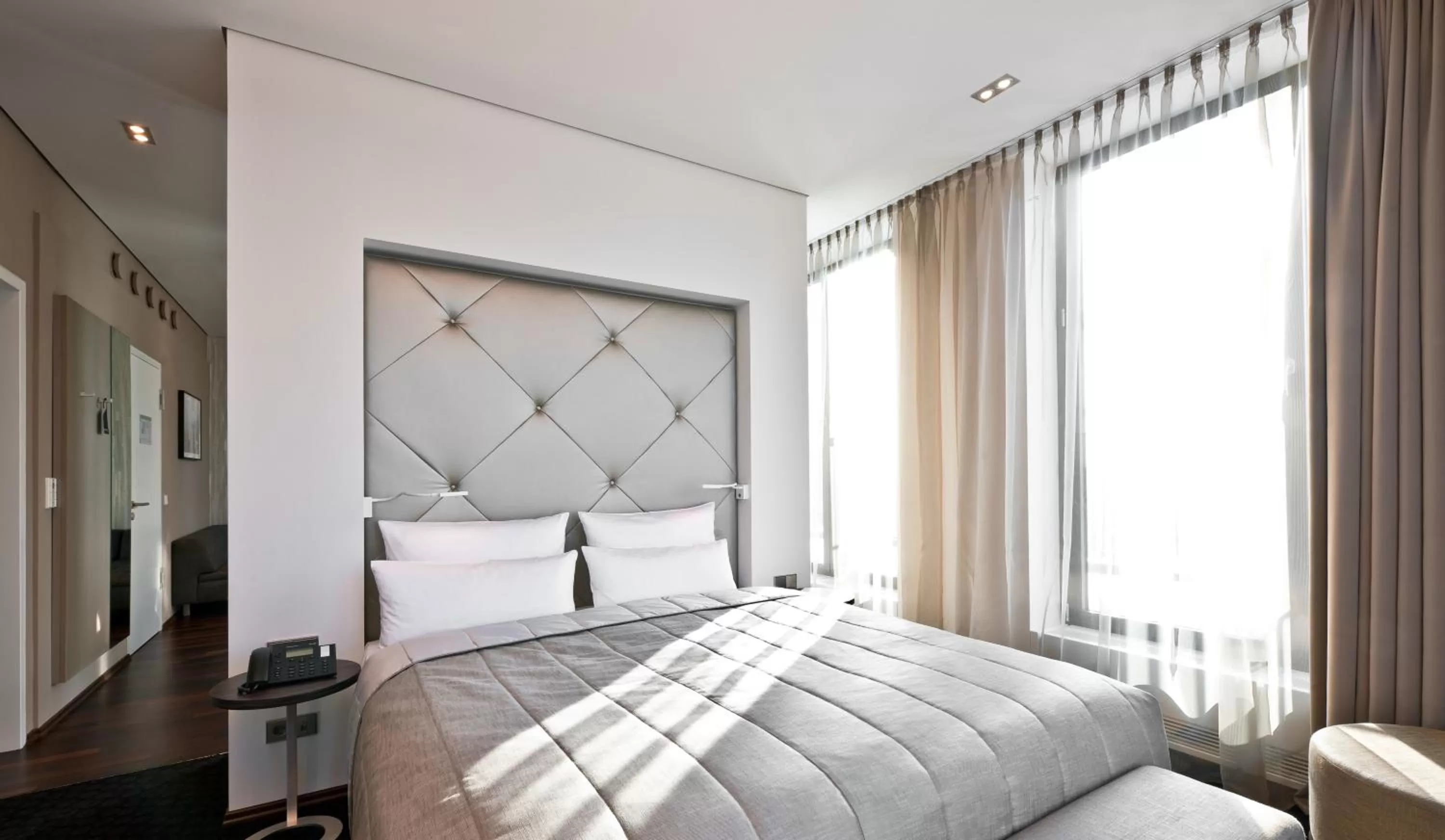 Bed in COSMO Hotel Berlin Mitte