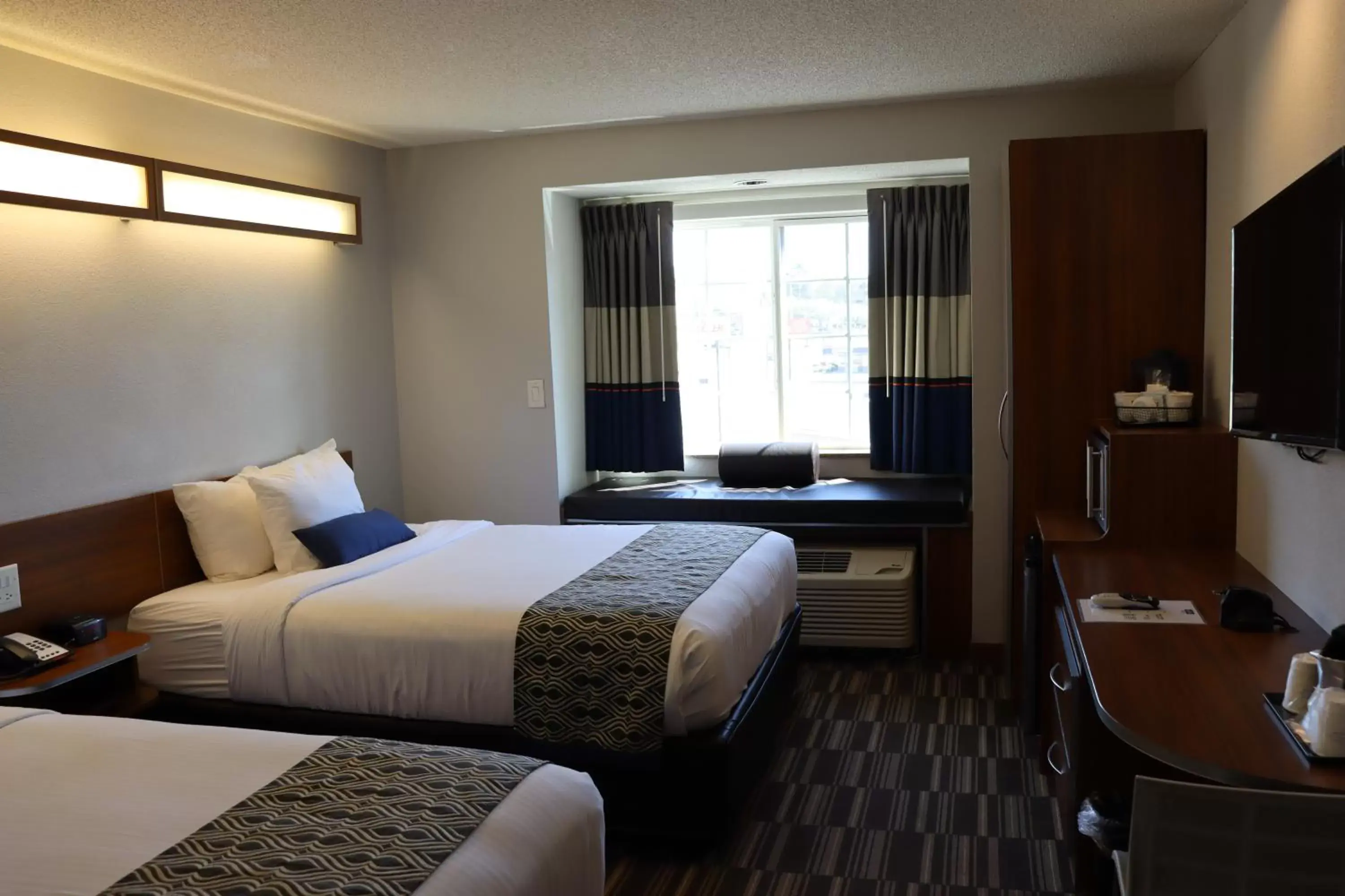 Bed in Microtel Inn & Suites by Wyndham Columbus Near Fort Moore