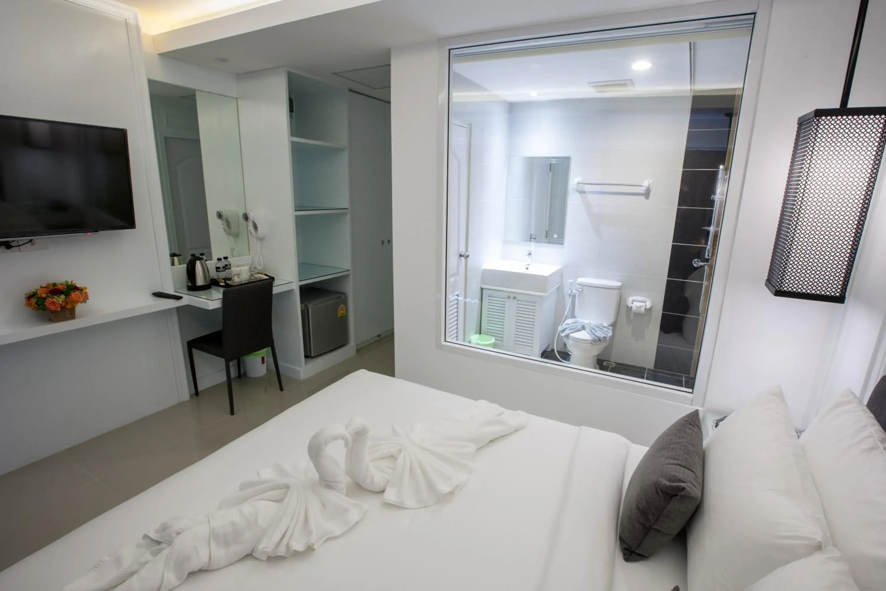 Bed, TV/Entertainment Center in Stay With Hug Poshtel & Activities
