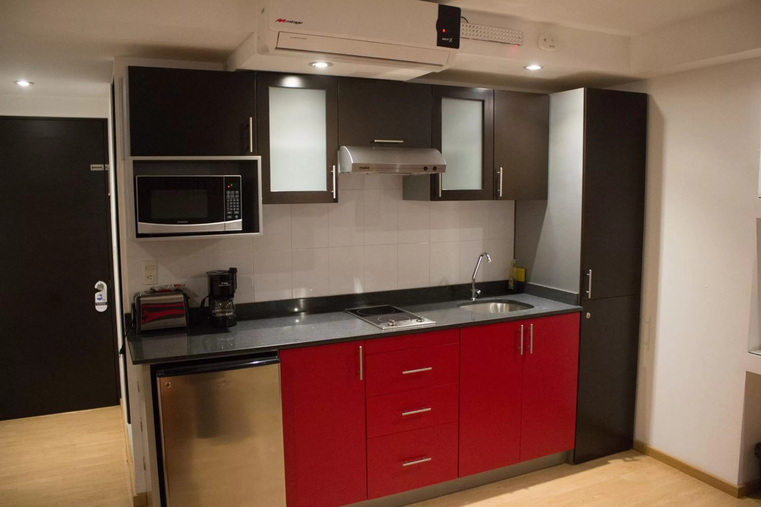 Kitchen or kitchenette in My Home Suites