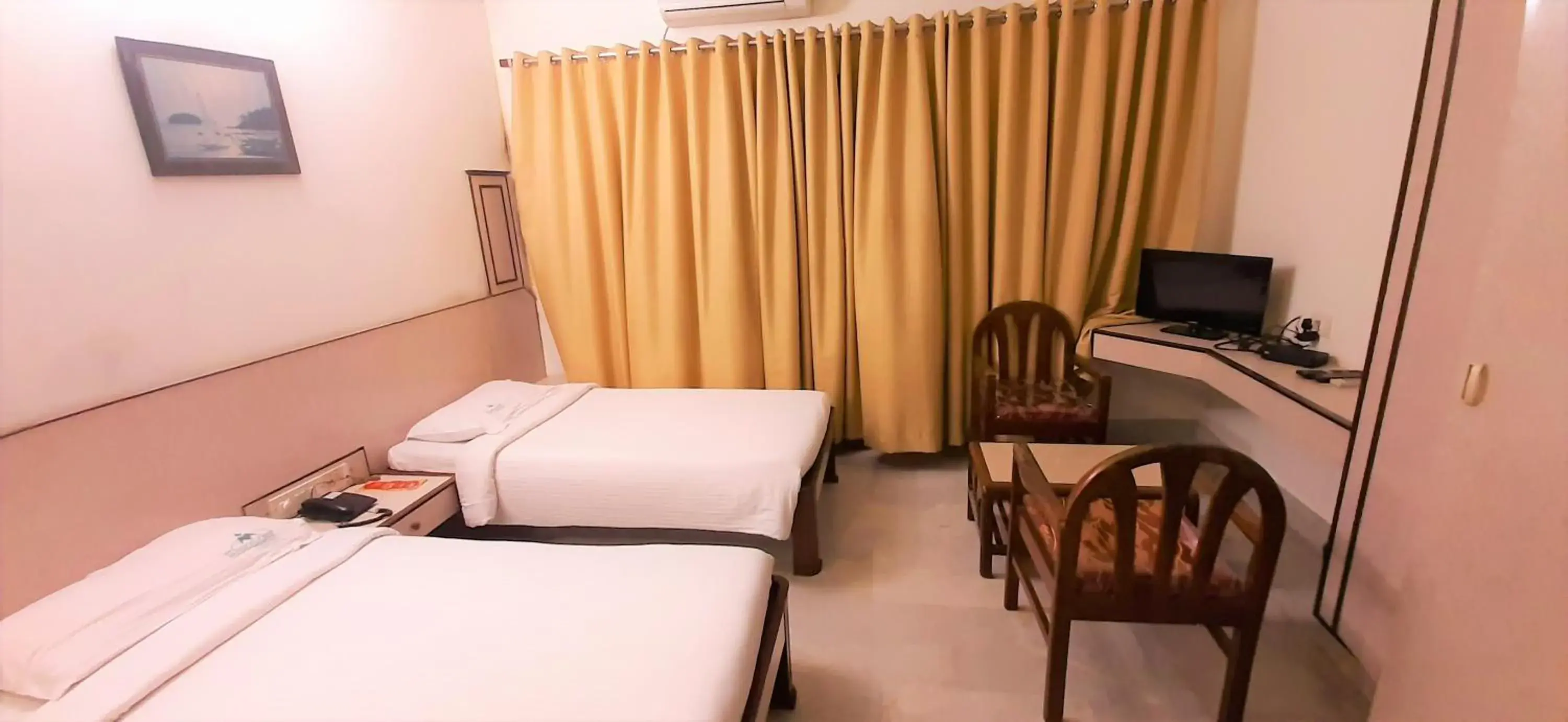 Photo of the whole room, TV/Entertainment Center in Hotel Mangalore International