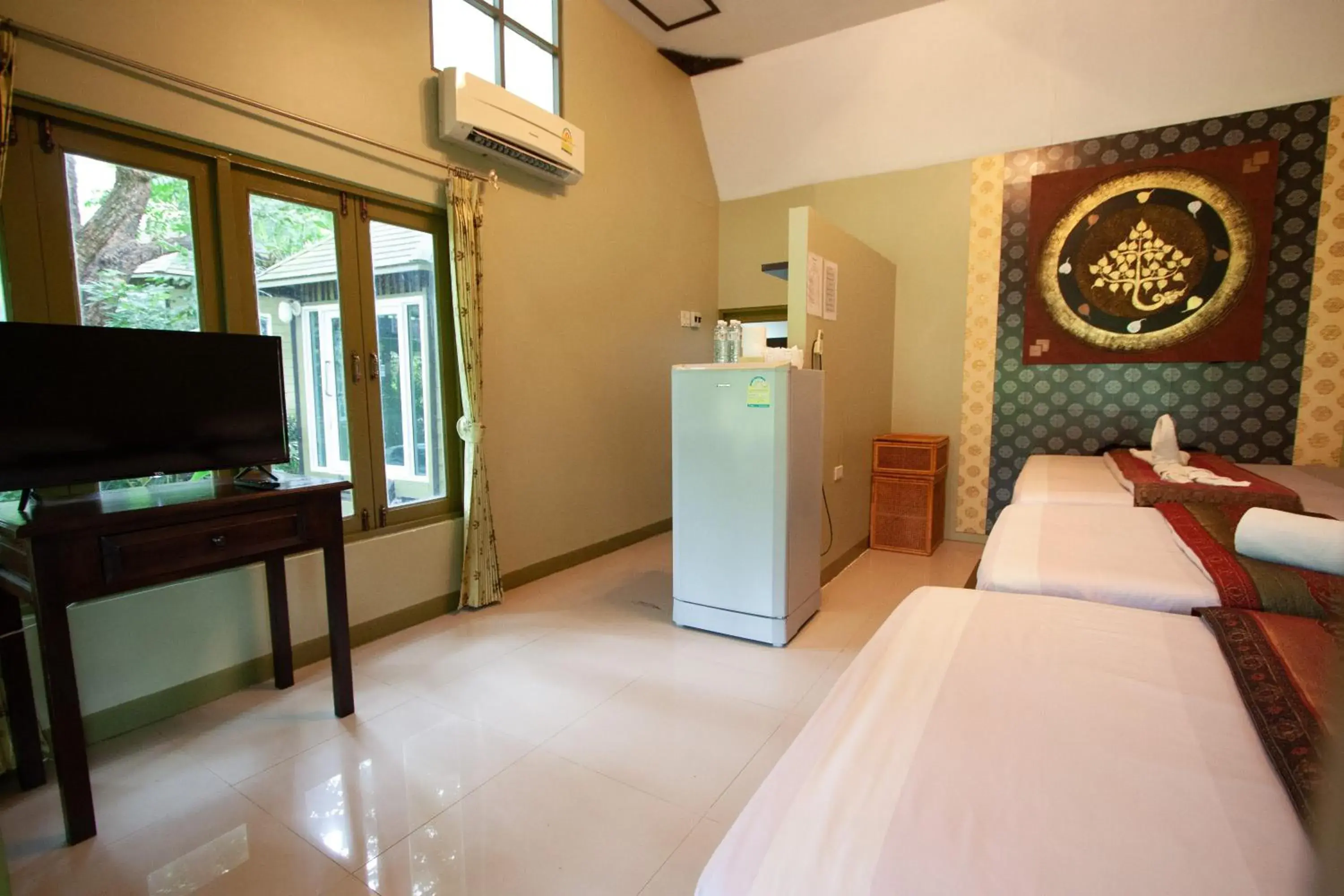 Bed, TV/Entertainment Center in Pai Panalee The Nature Boutique Hotel