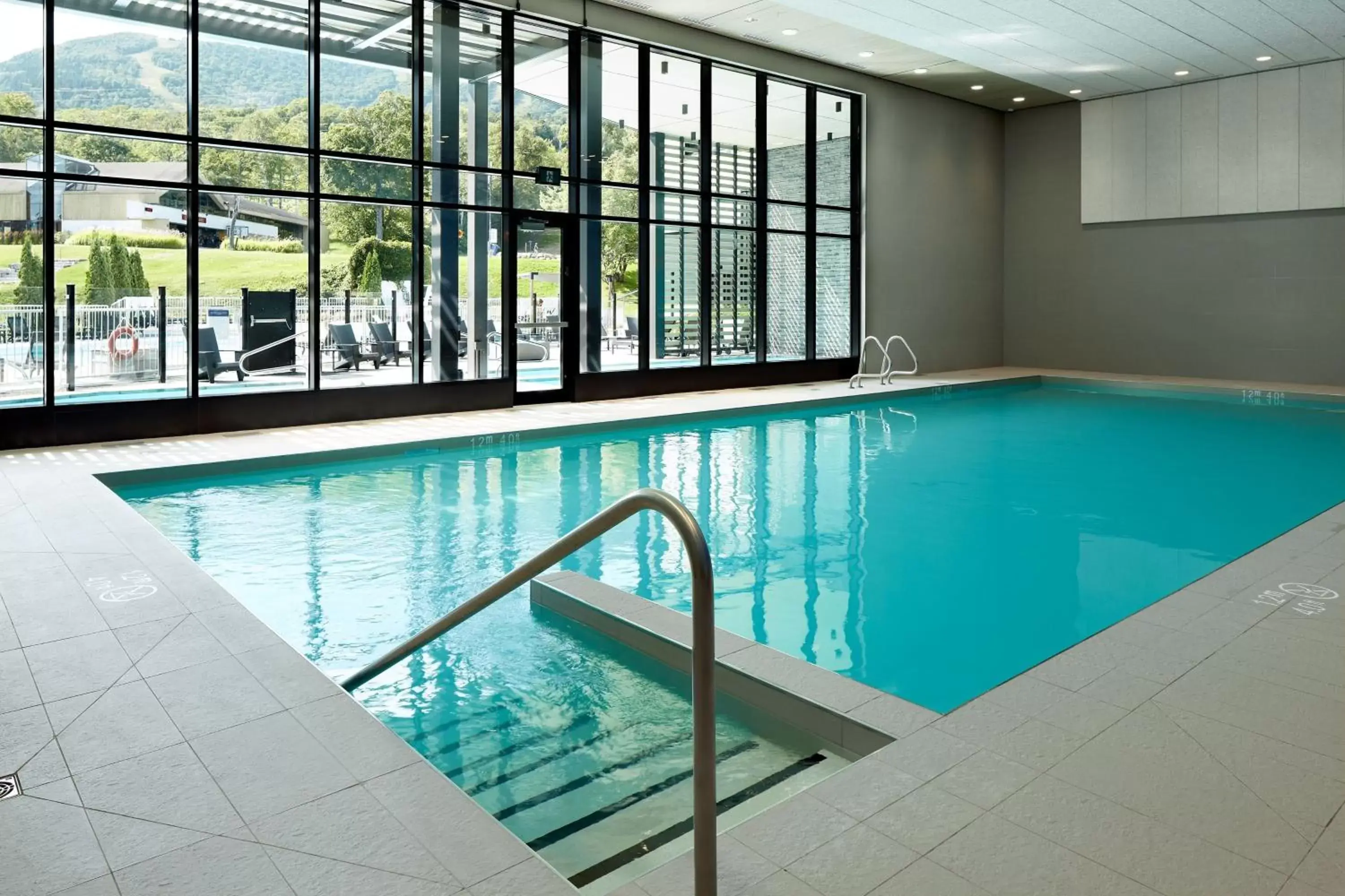 Swimming Pool in Delta Hotels by Marriott Mont Sainte-Anne, Resort & Convention Center