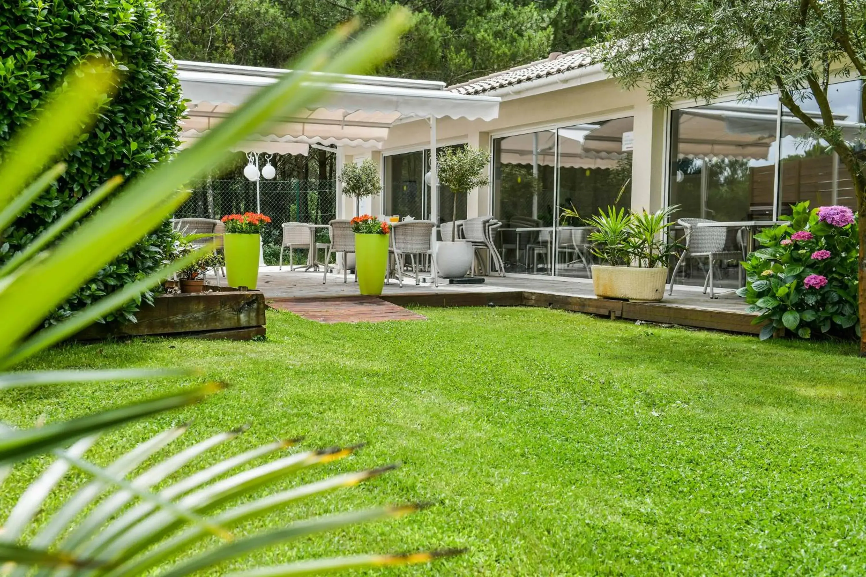 Garden view in Logis Hôtel La Forestière Garden view in Logis Hôtel La Forestière