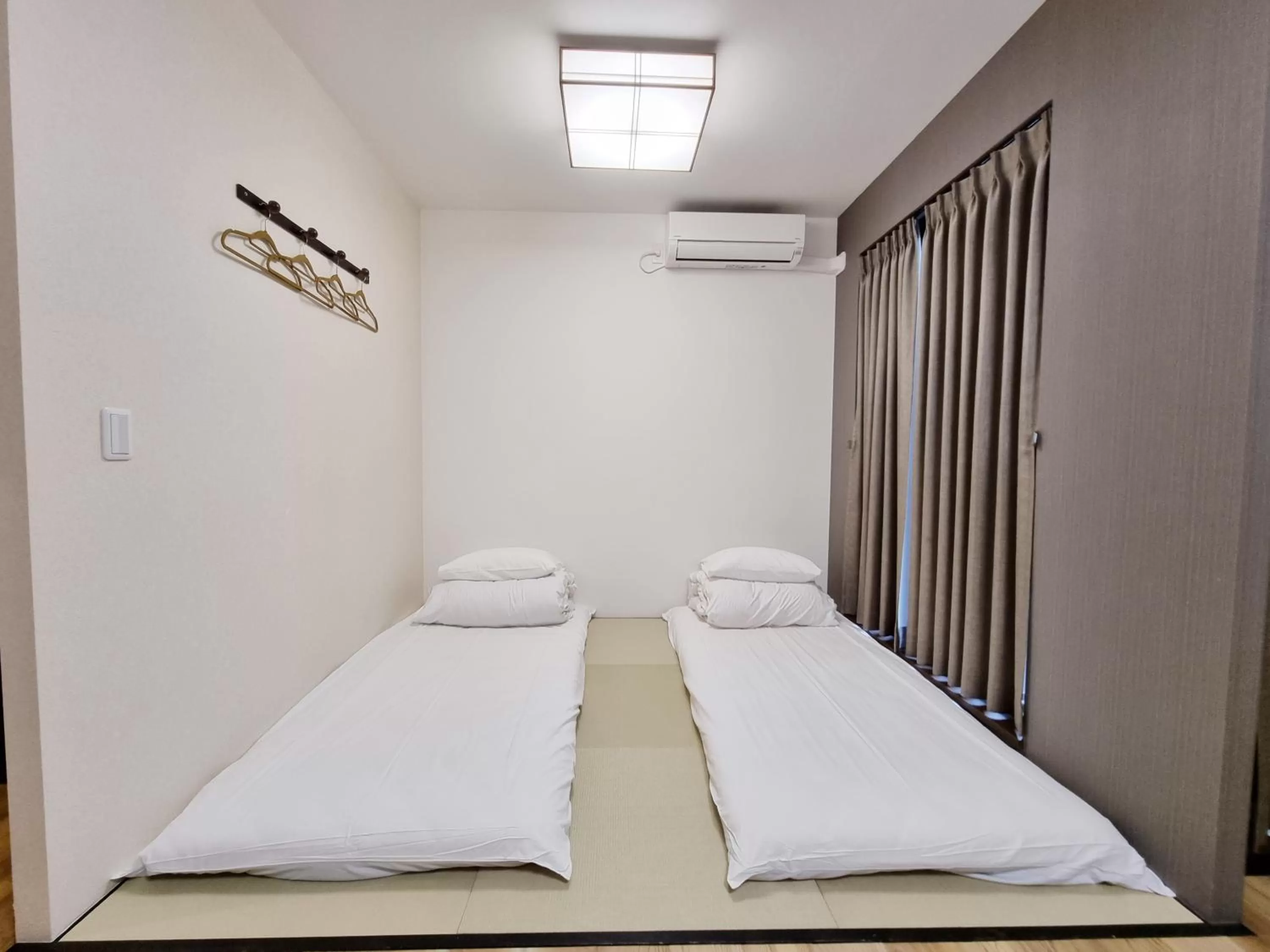 Photo of the whole room, Bed in KYU KYU HOTEL