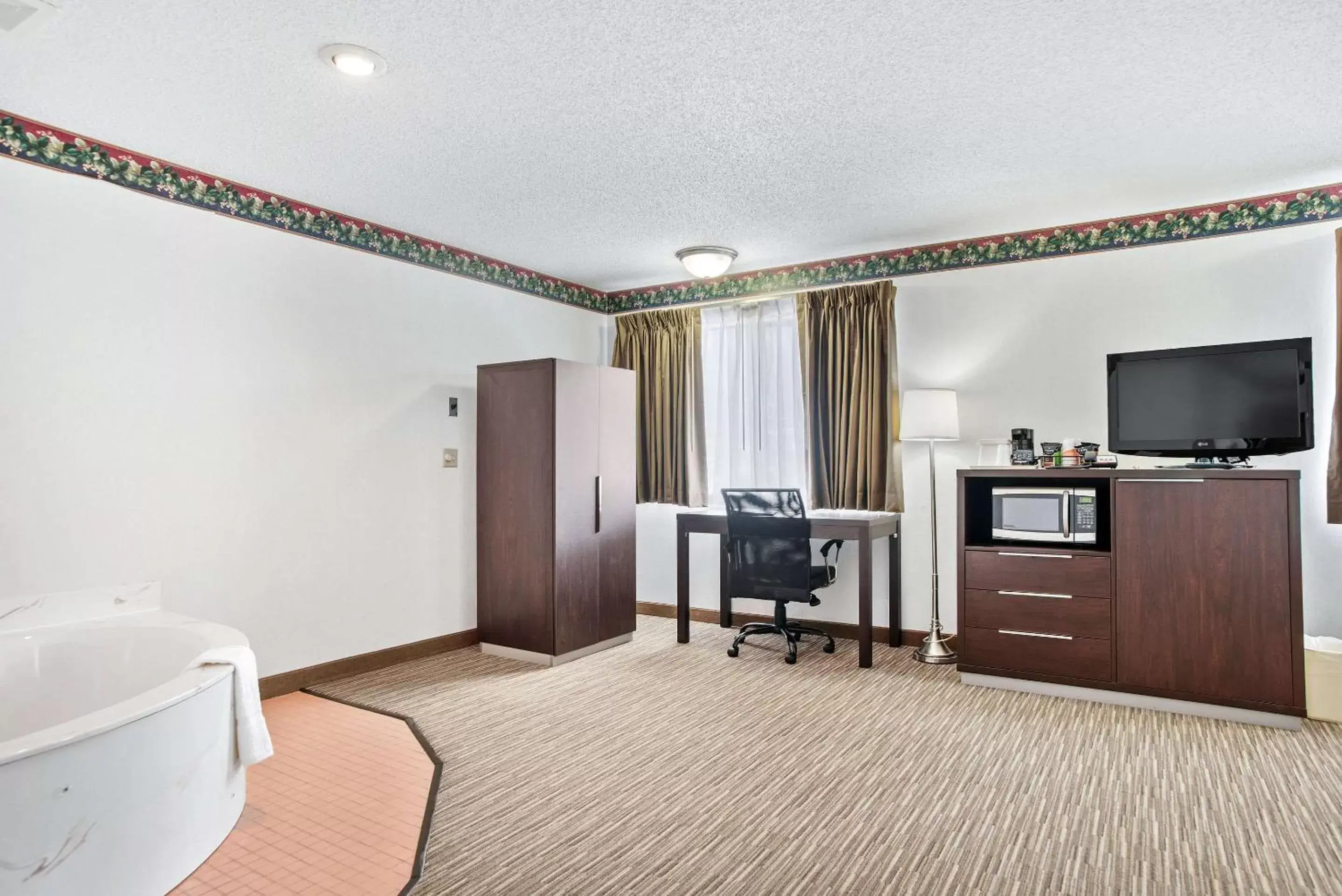 Photo of the whole room, TV/Entertainment Center in EverSpring Inn & Suites