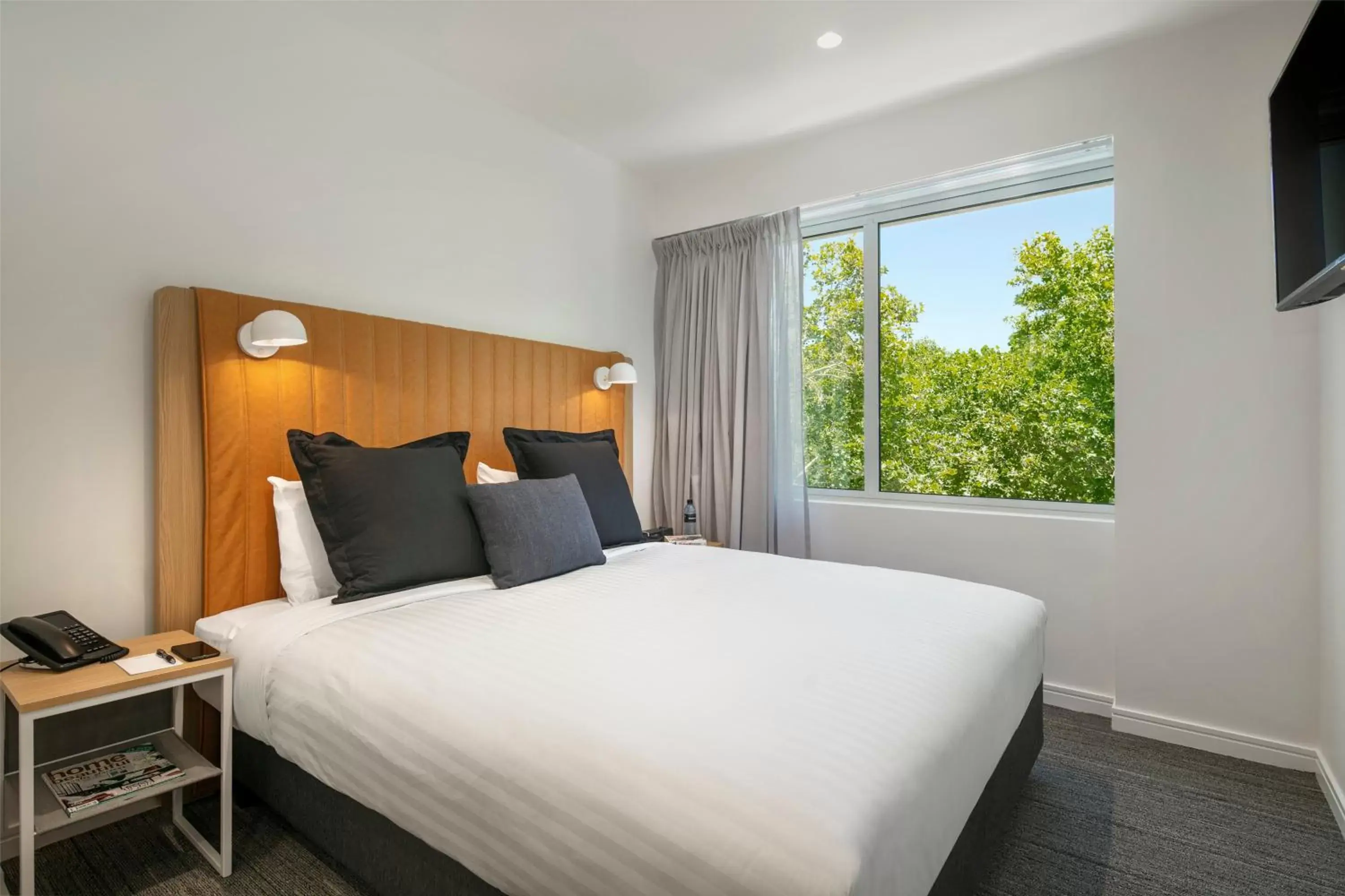Bed in Quest Canberra City Walk