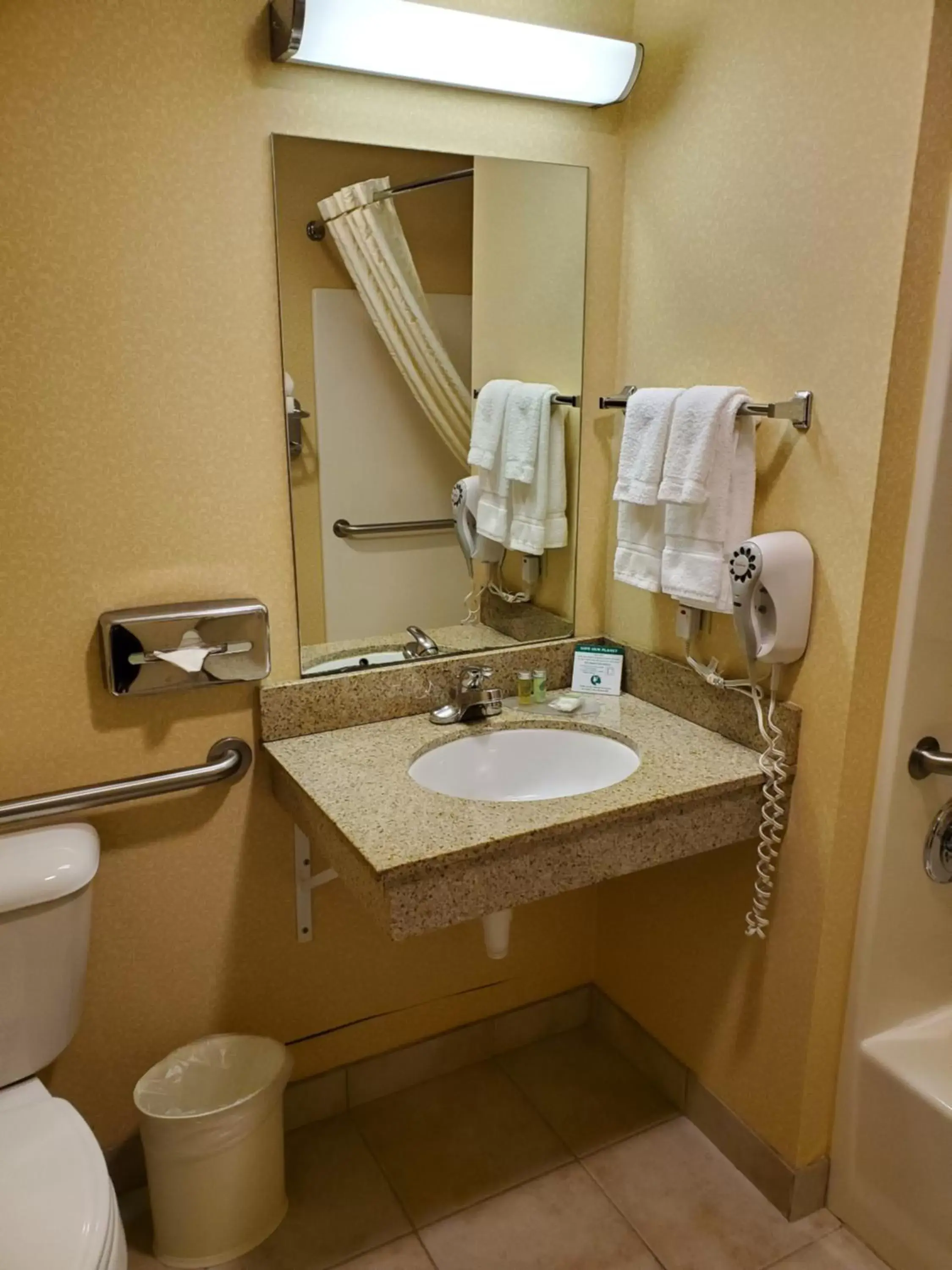 Bathroom in Boarders Inn & Suites by Cobblestone Hotels - Shawano Bathroom in Boarders Inn & Suites by Cobblestone Hotels - Shawano