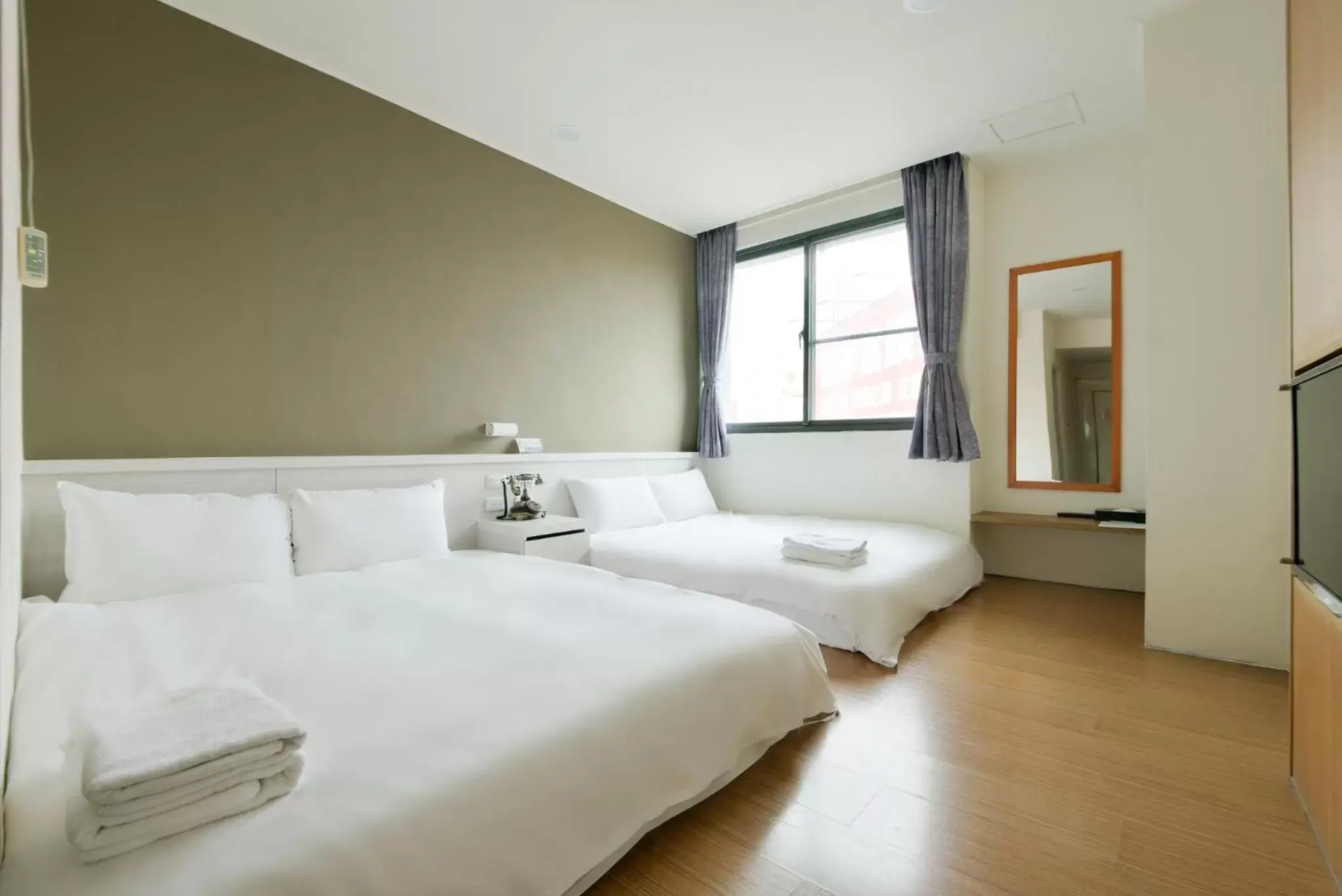 Bed in Raise Hotel Taichung