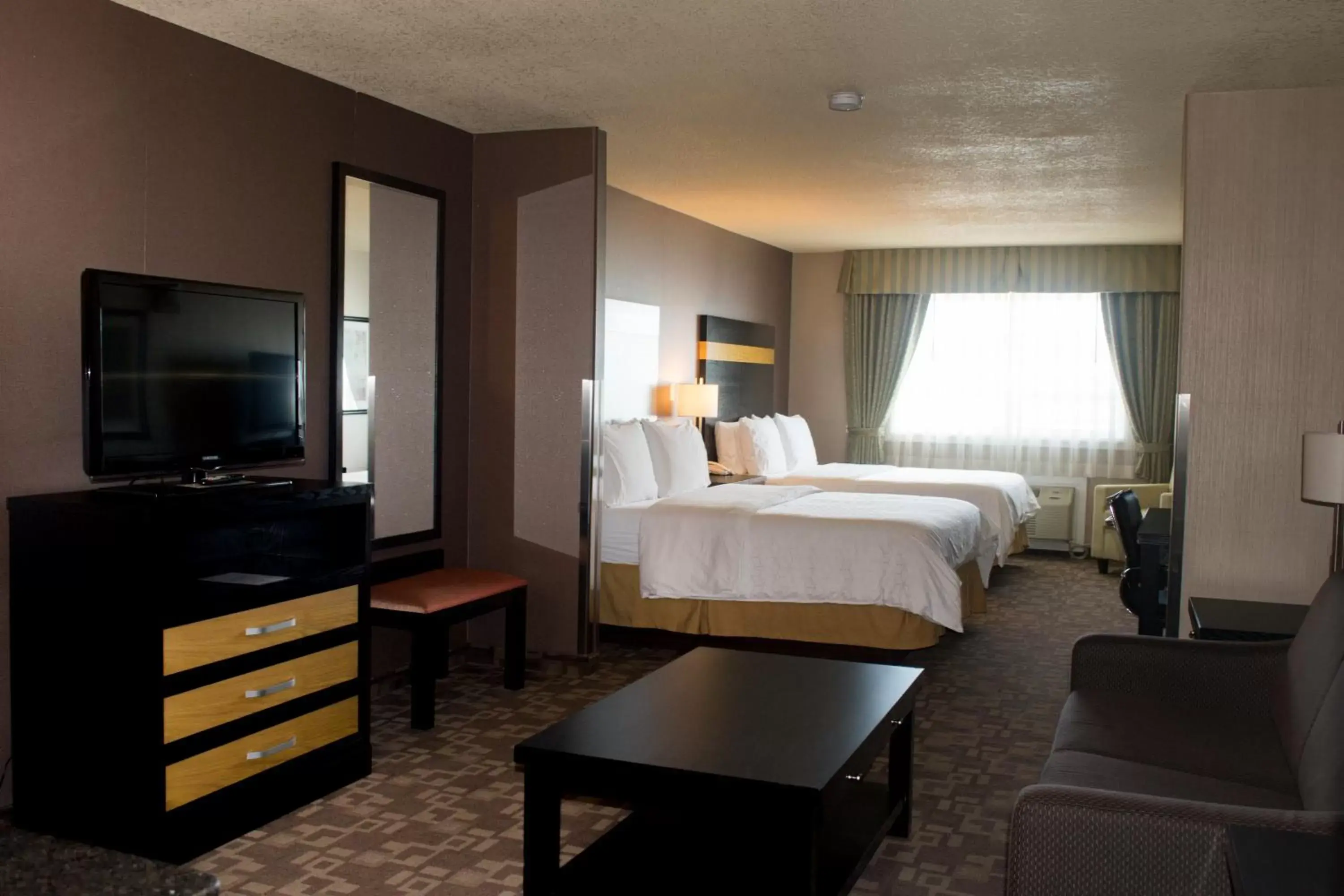 Photo of the whole room, TV/Entertainment Center in Holiday Inn Express and Suites Dawson Creek, an IHG Hotel