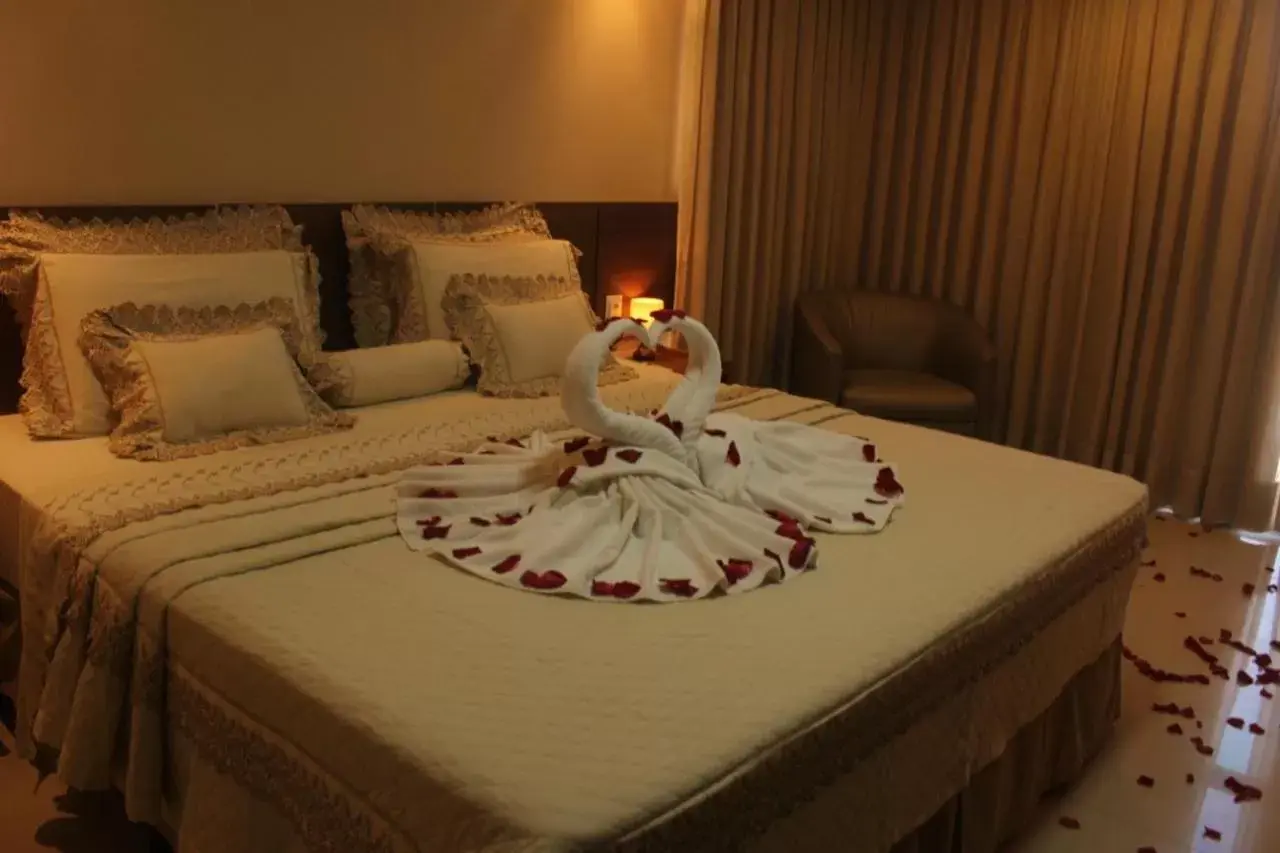 Bed in Netuanah Praia Hotel