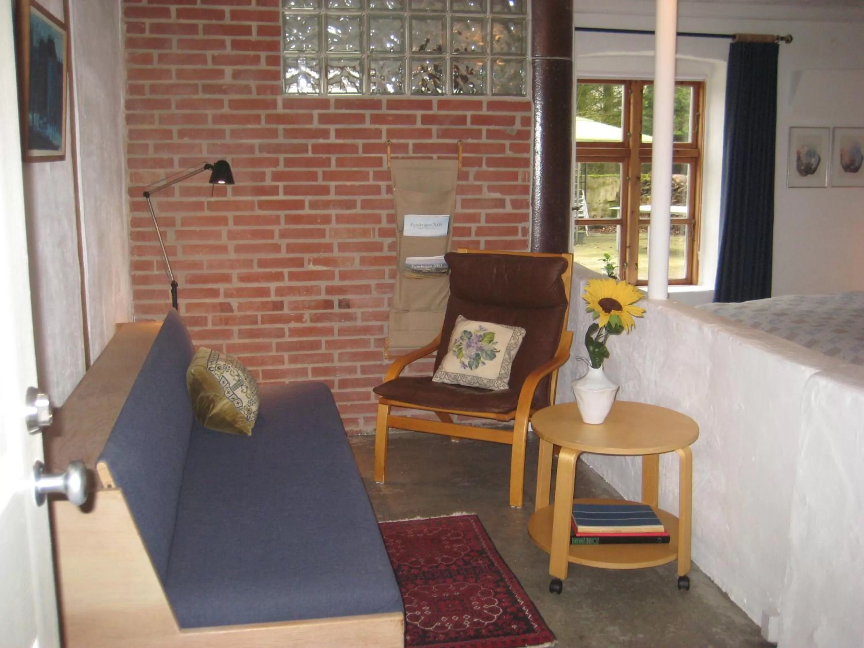 Bed, Seating Area in Billund Resort – Ravning