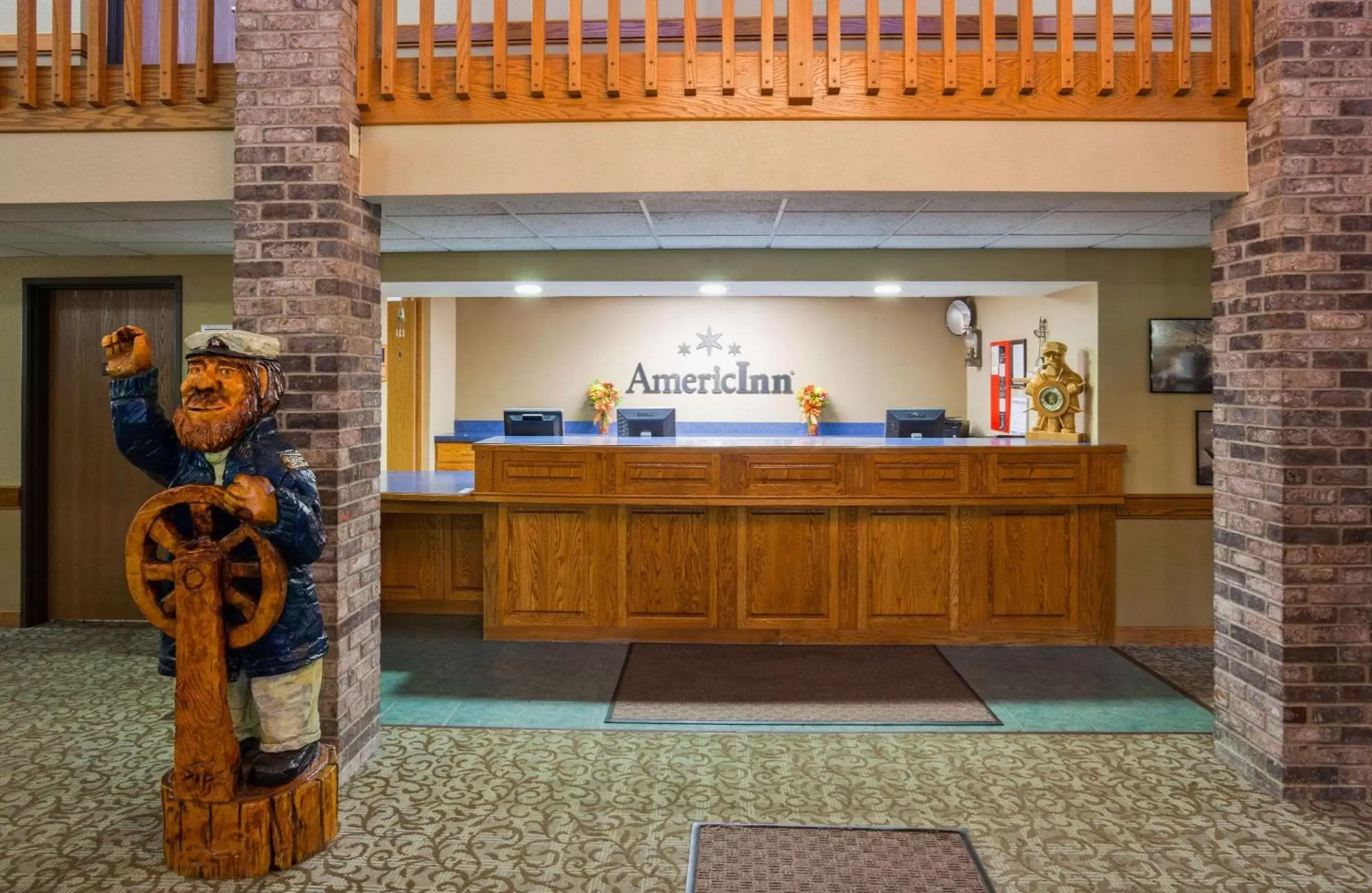 Lobby or reception in AmericInn by Wyndham Menominee