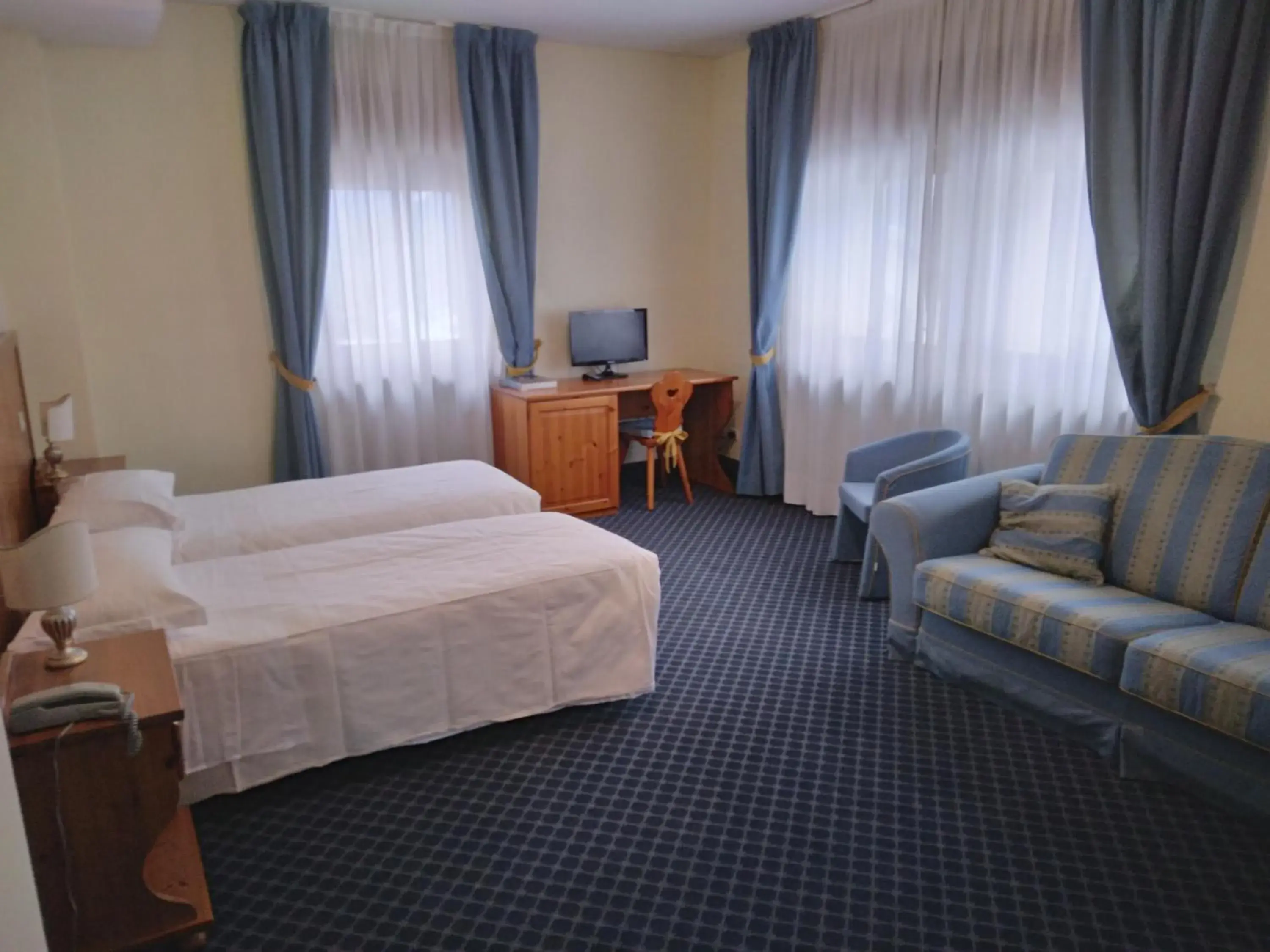 Bed in Hotel Belvedere Dolomiti