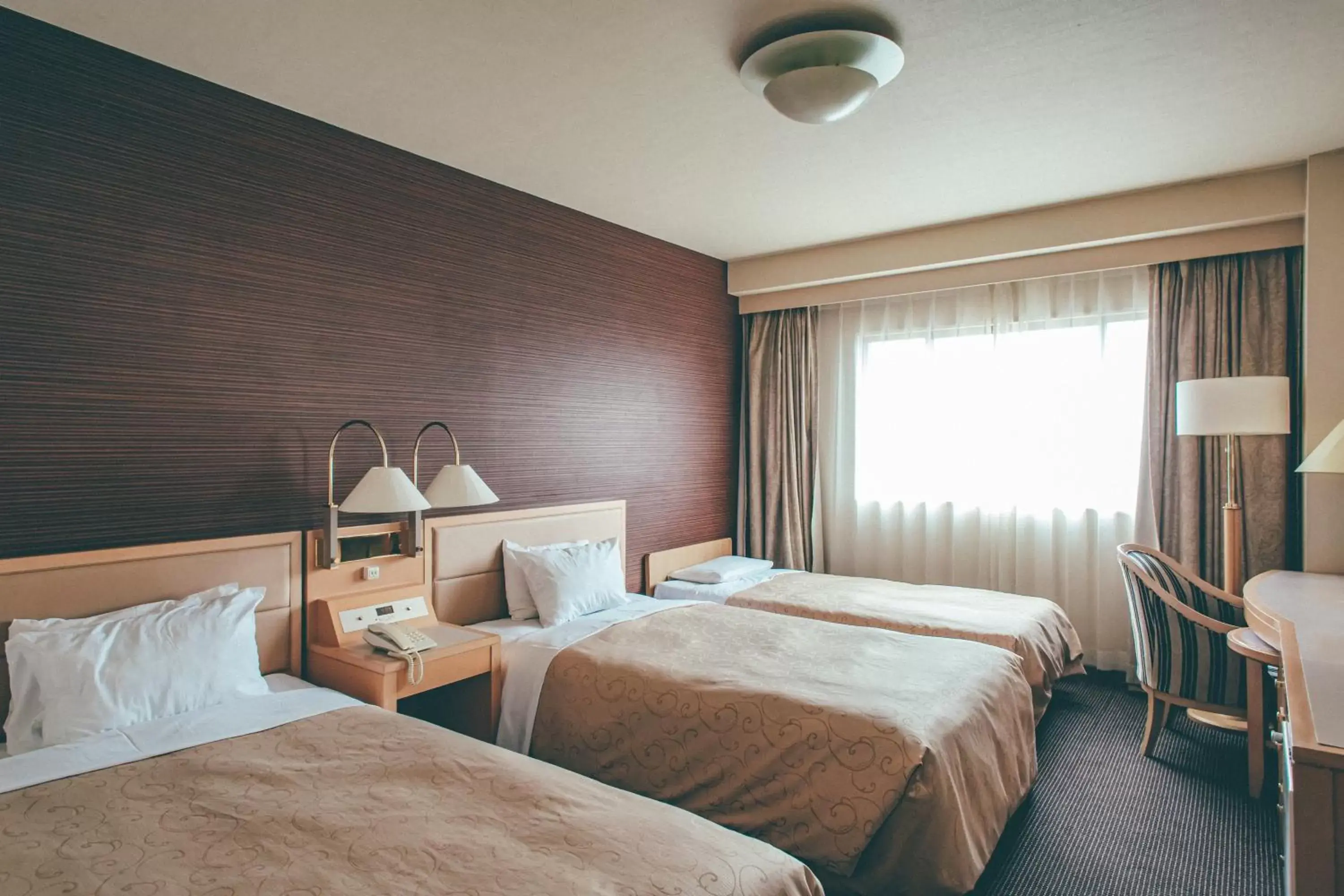 Bed in Numazu River Side Hotel