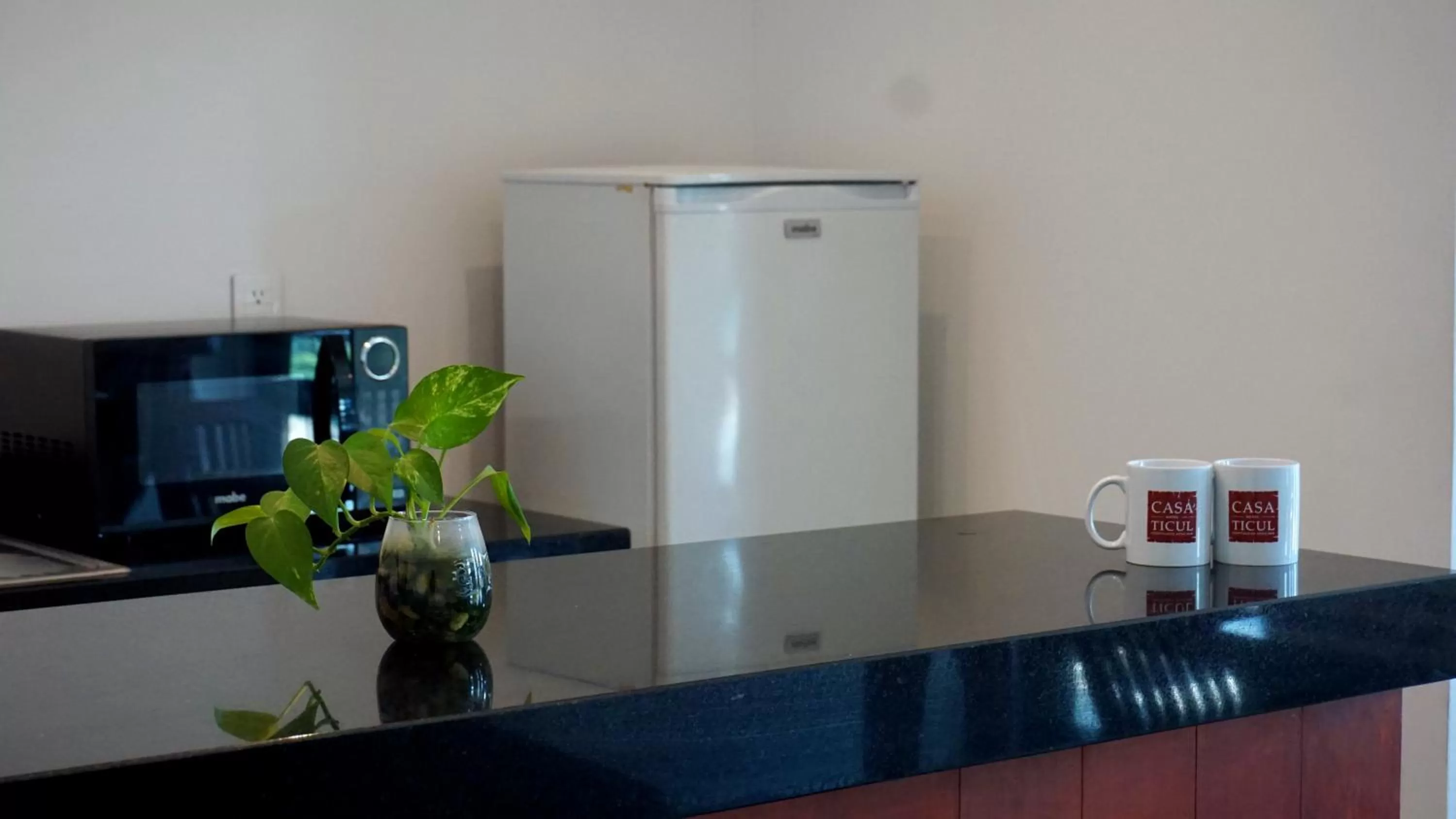 Dining area, TV/Entertainment Center in Casa Ticul Hotel Boutique - 5Th Ave by BFH