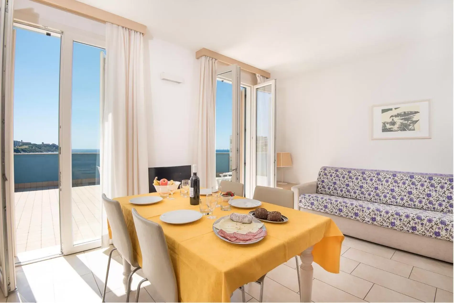 Living room, Dining Area in Residence Marina Salivoli