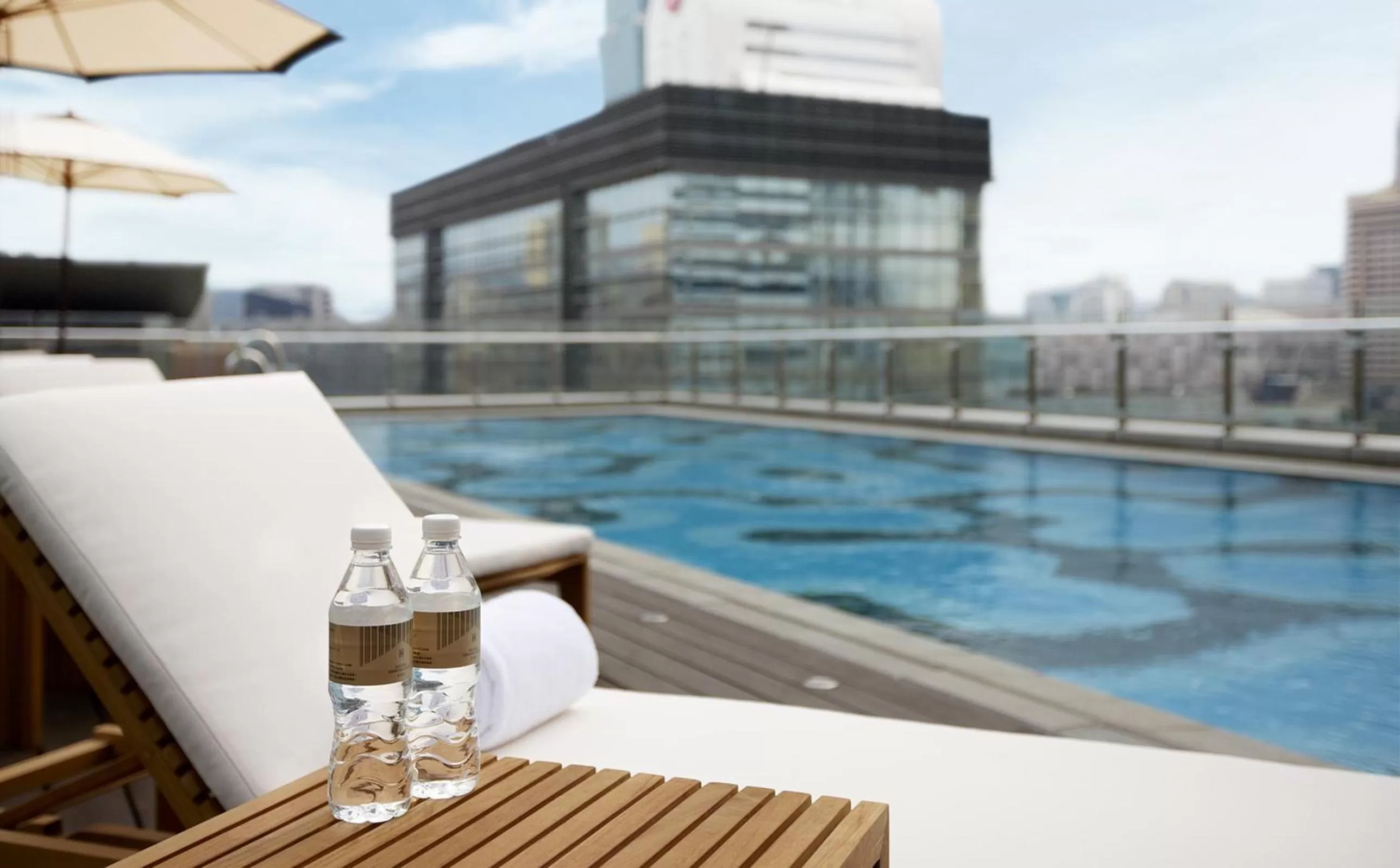 Swimming pool in Humble House Taipei, Curio Collection by Hilton