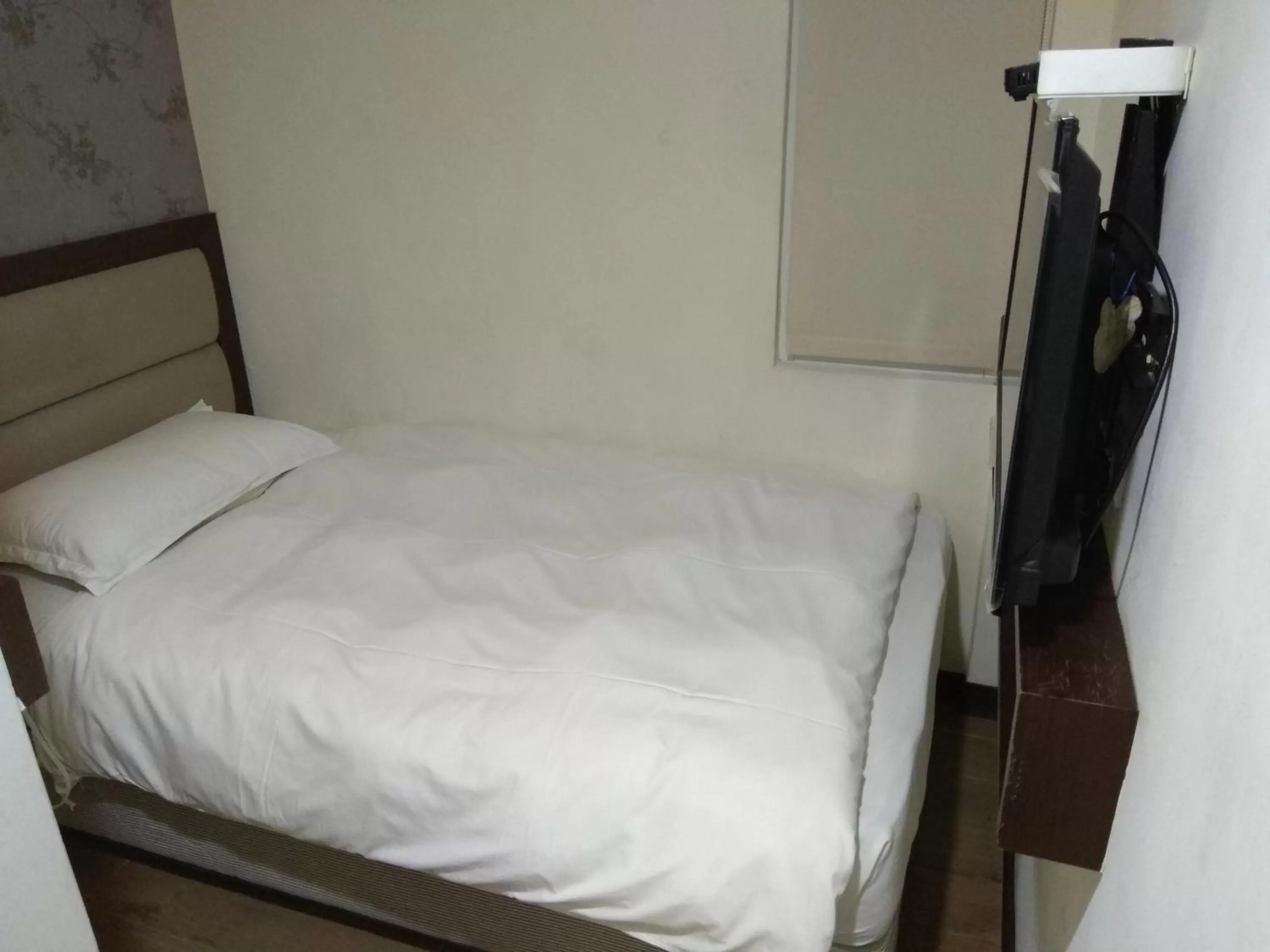 Bed in 德瑞旅店Direct Hotel