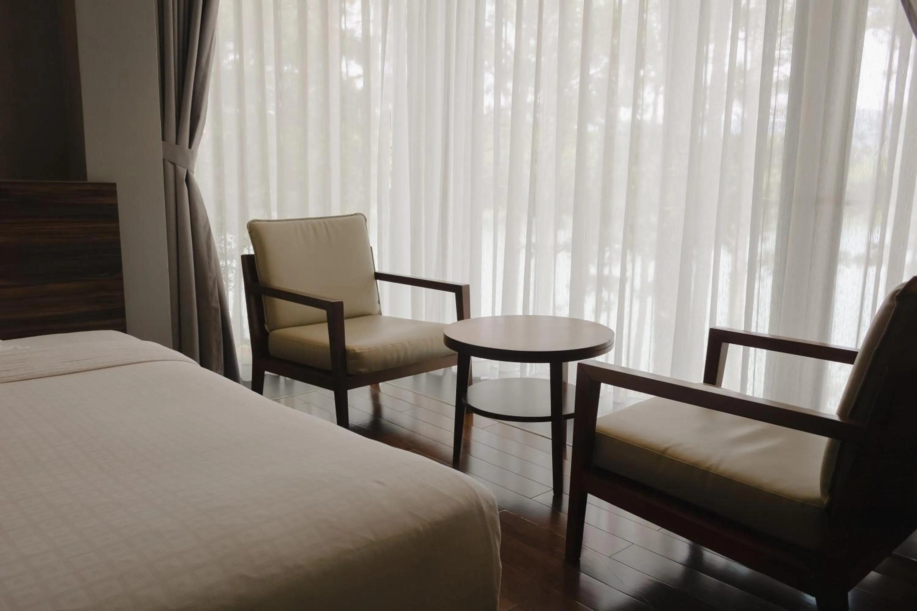 Seating area, Bed in Terracotta Hotel & Resort Dalat