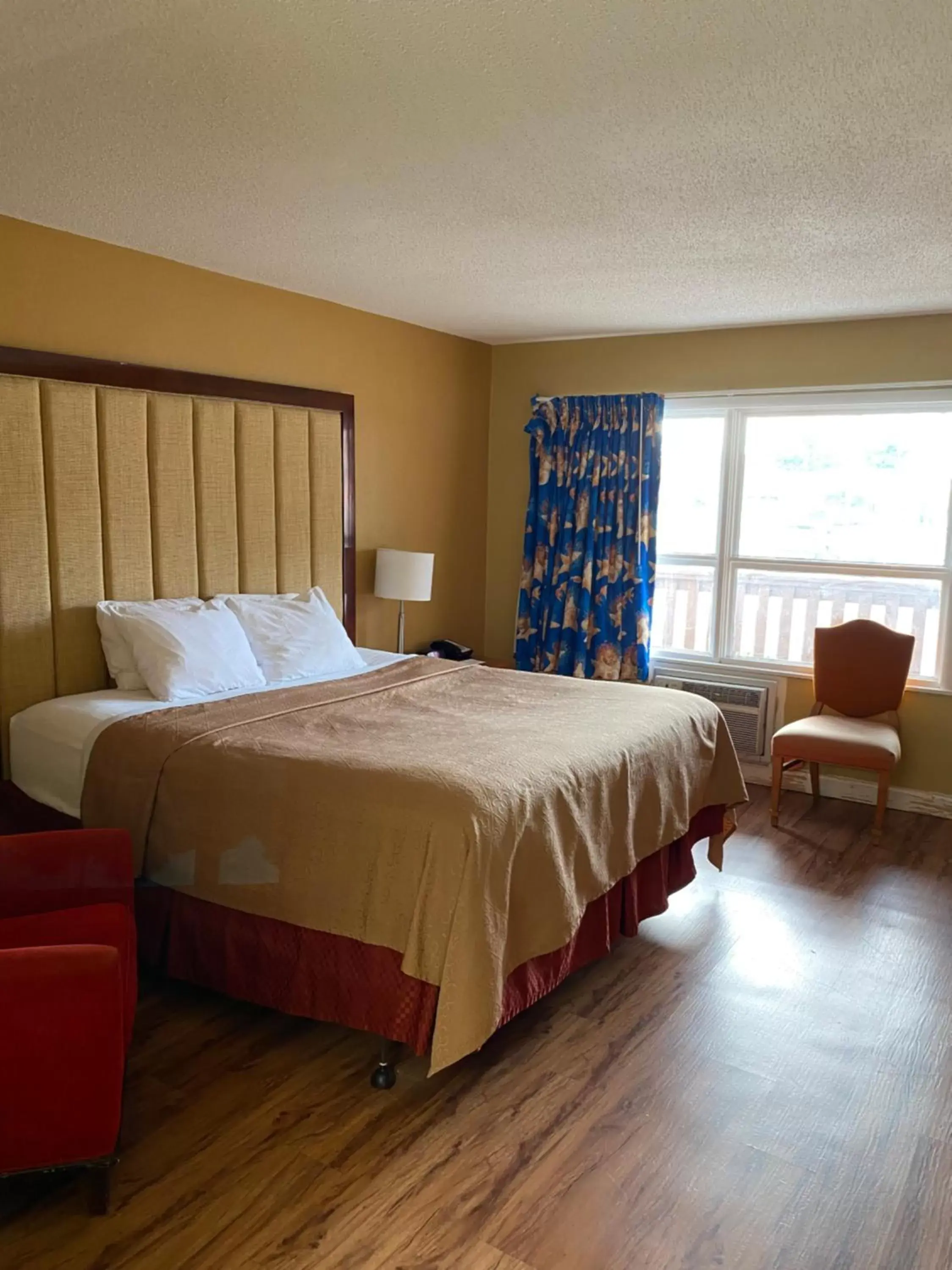 Bed in Atlantic Shores Inn and Suites