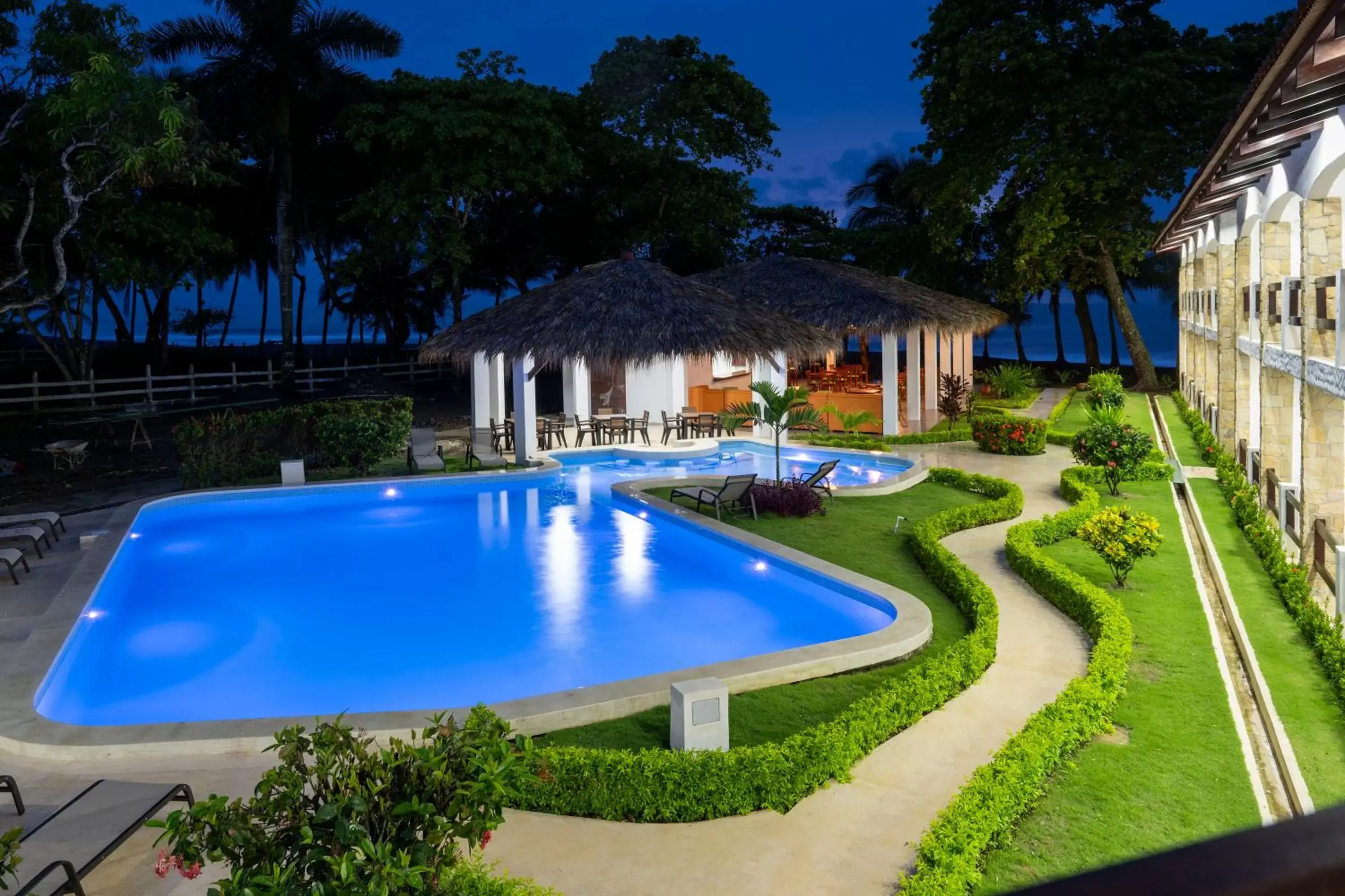 Garden view, Swimming Pool in Fuego del Sol Beachfront Hotel
