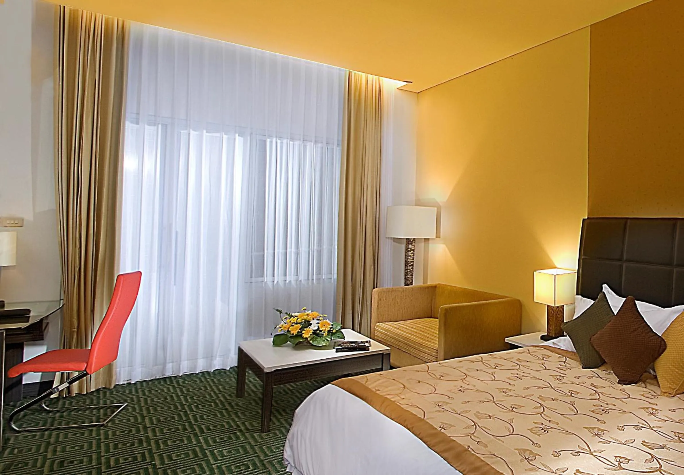 Seating area, Bed in Golden Flower by KAGUM Hotels