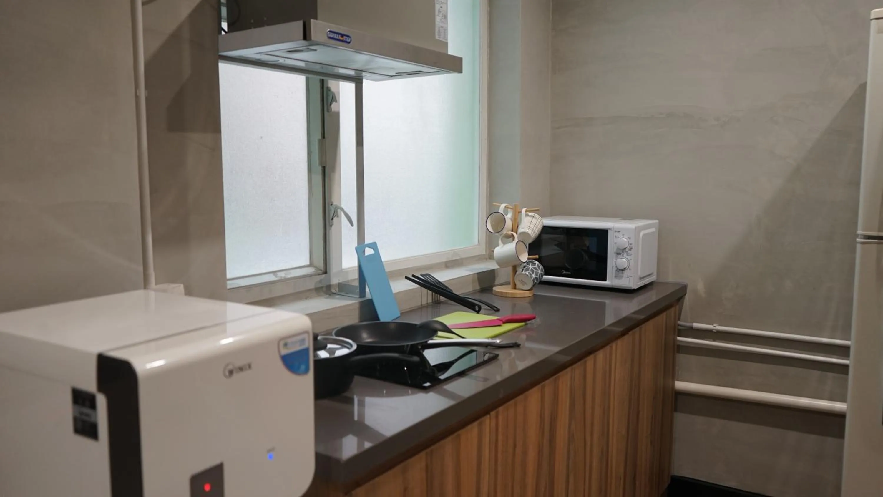 Communal kitchen in Homy Inn North Point