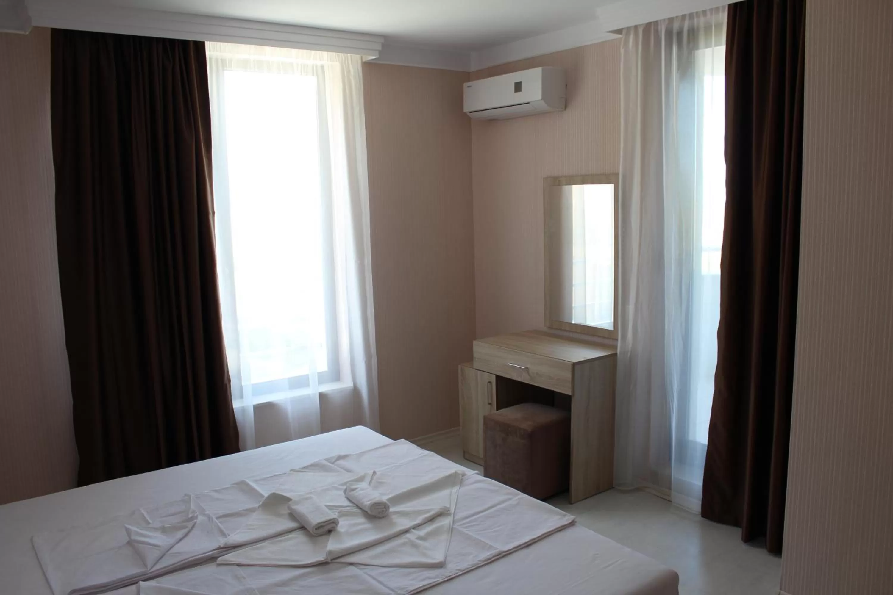 Bed in APART-HOTEL Stamopolu Lux с изглед към морето