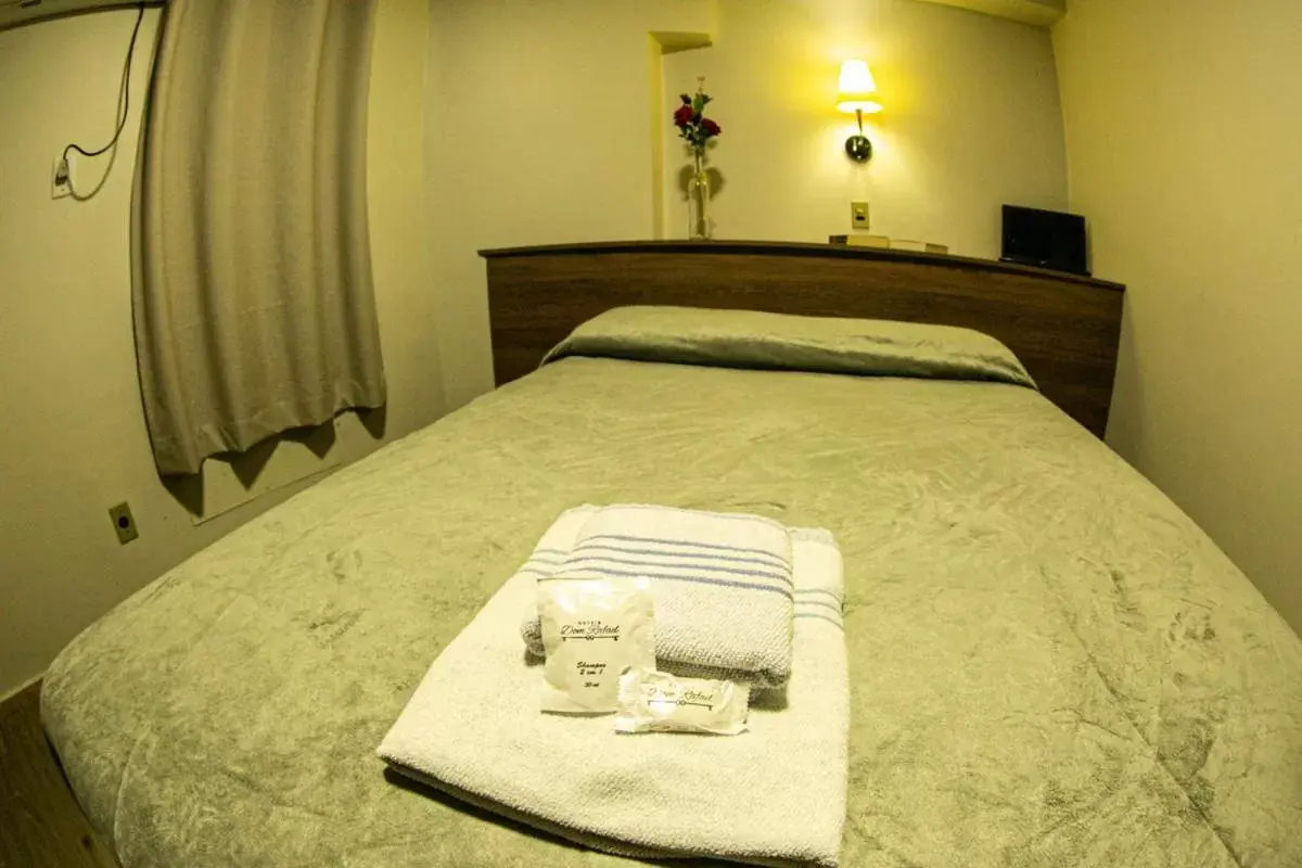 Bed in Hotel Dom Rafael Executivo