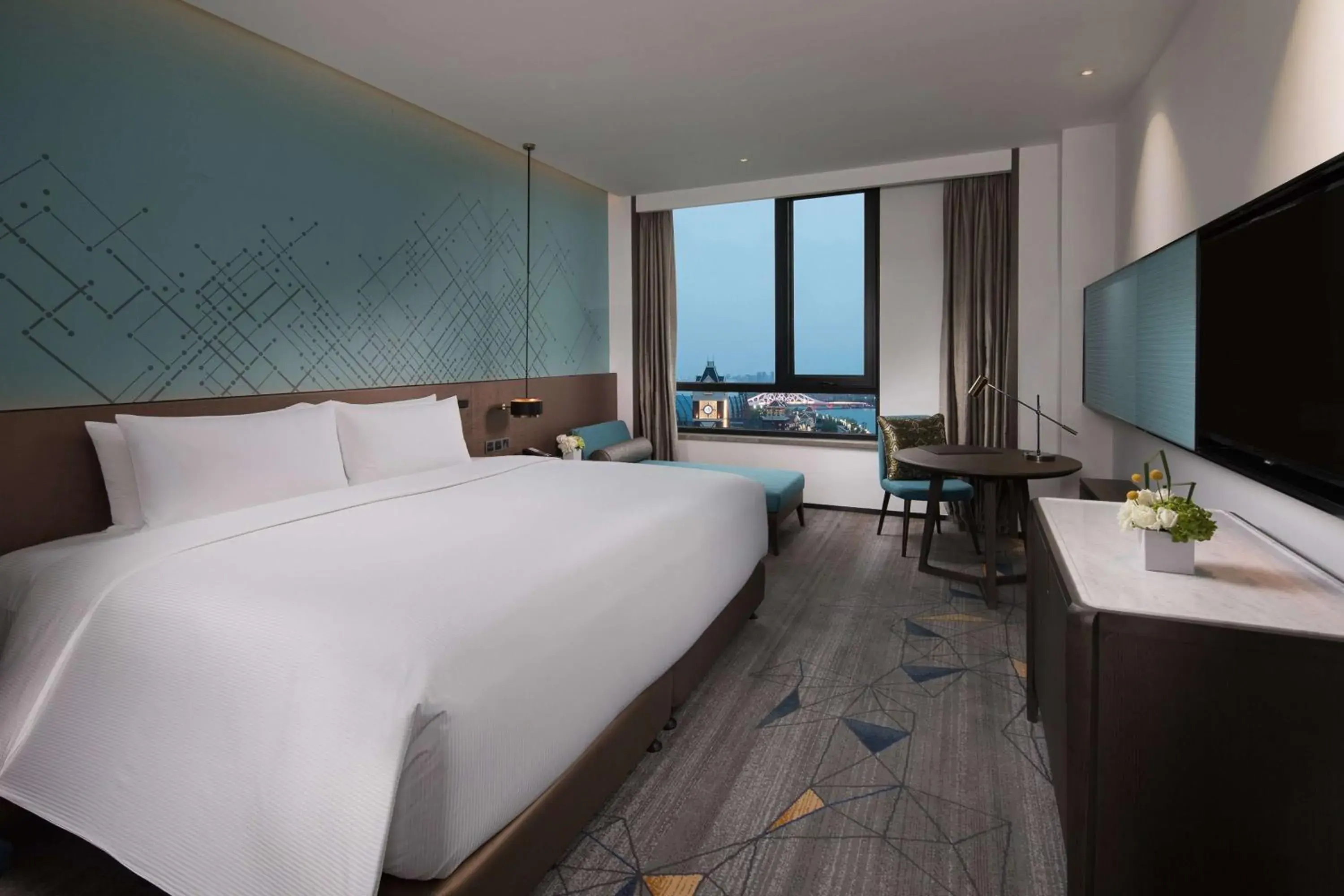 Property building, Bed in Doubletree By Hilton Qingdao Oriental Movie Metropolis Property building, Bed in Doubletree By Hilton Qingdao Oriental Movie Metropolis