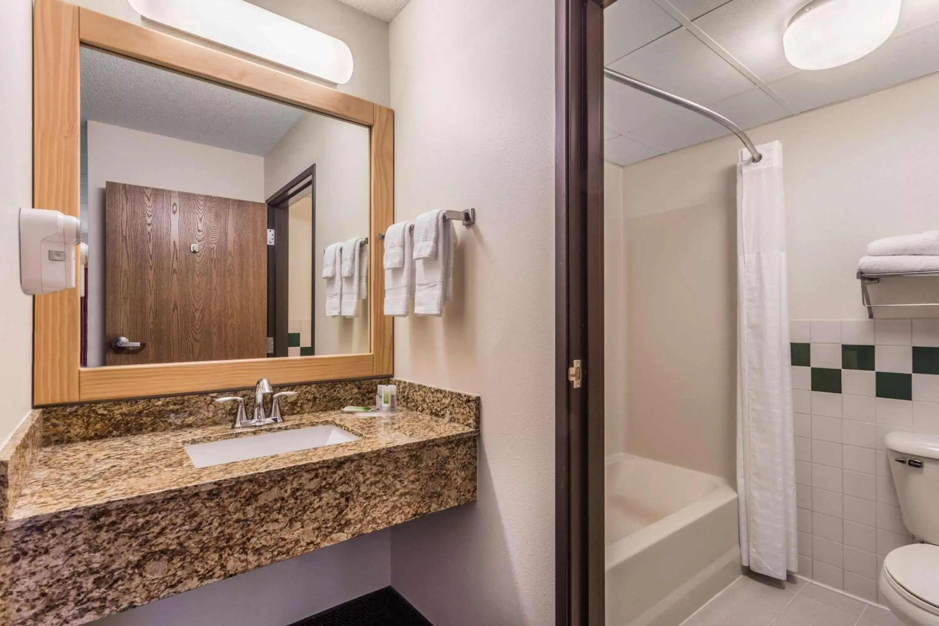 Bathroom in AmericInn by Wyndham Wisconsin Dells