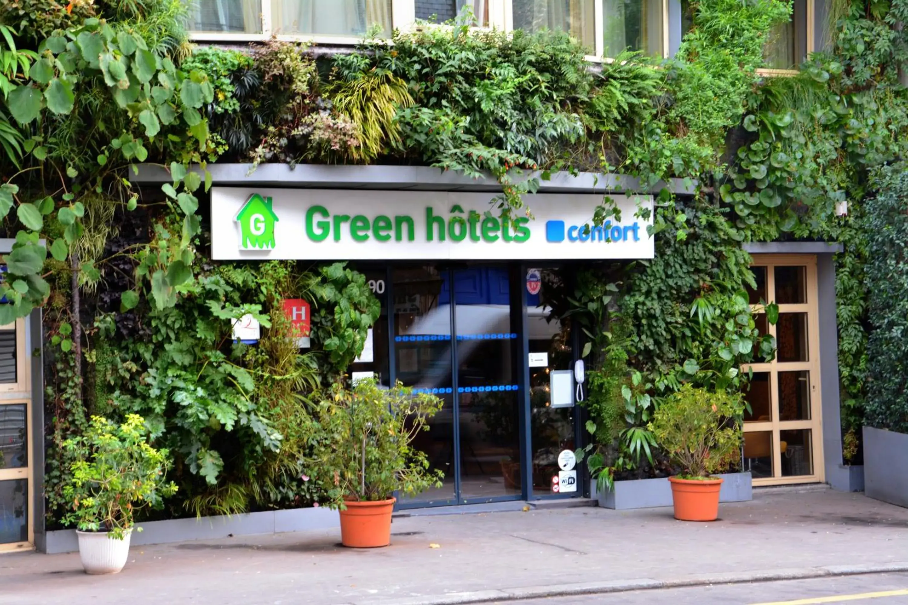 Property building in Green hotels Confort Paris 13
