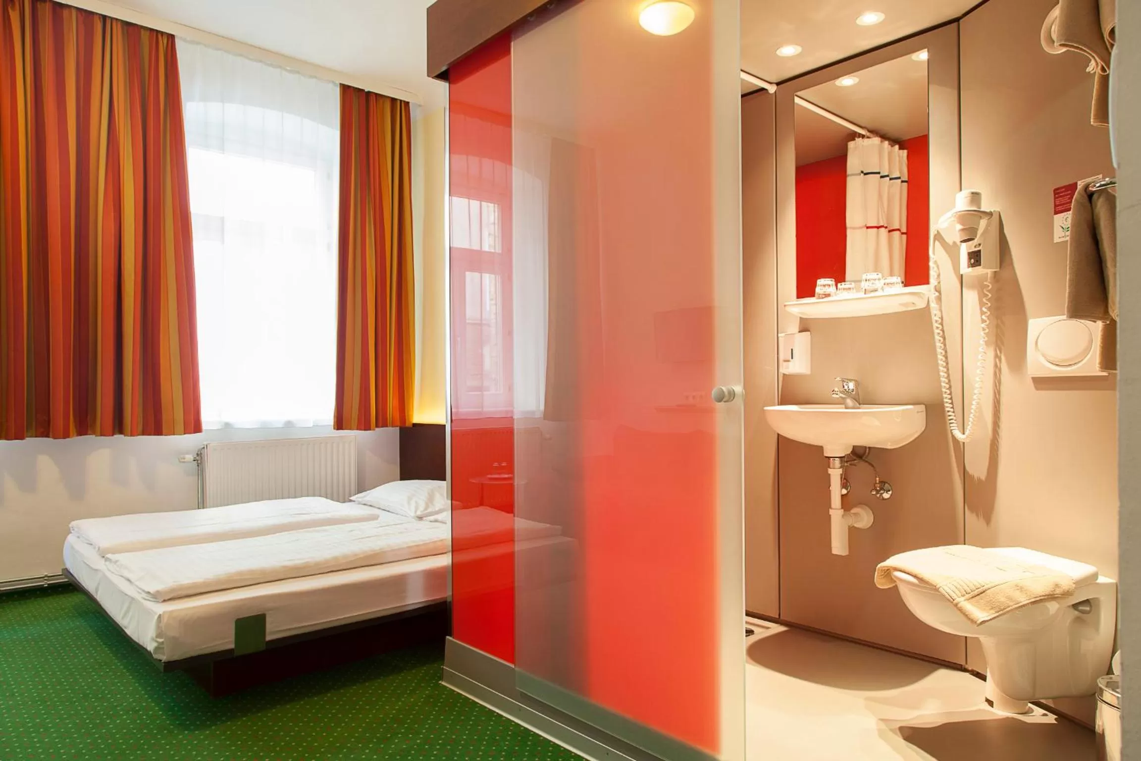 Photo of the whole room, Bed in Pension Stadthalle