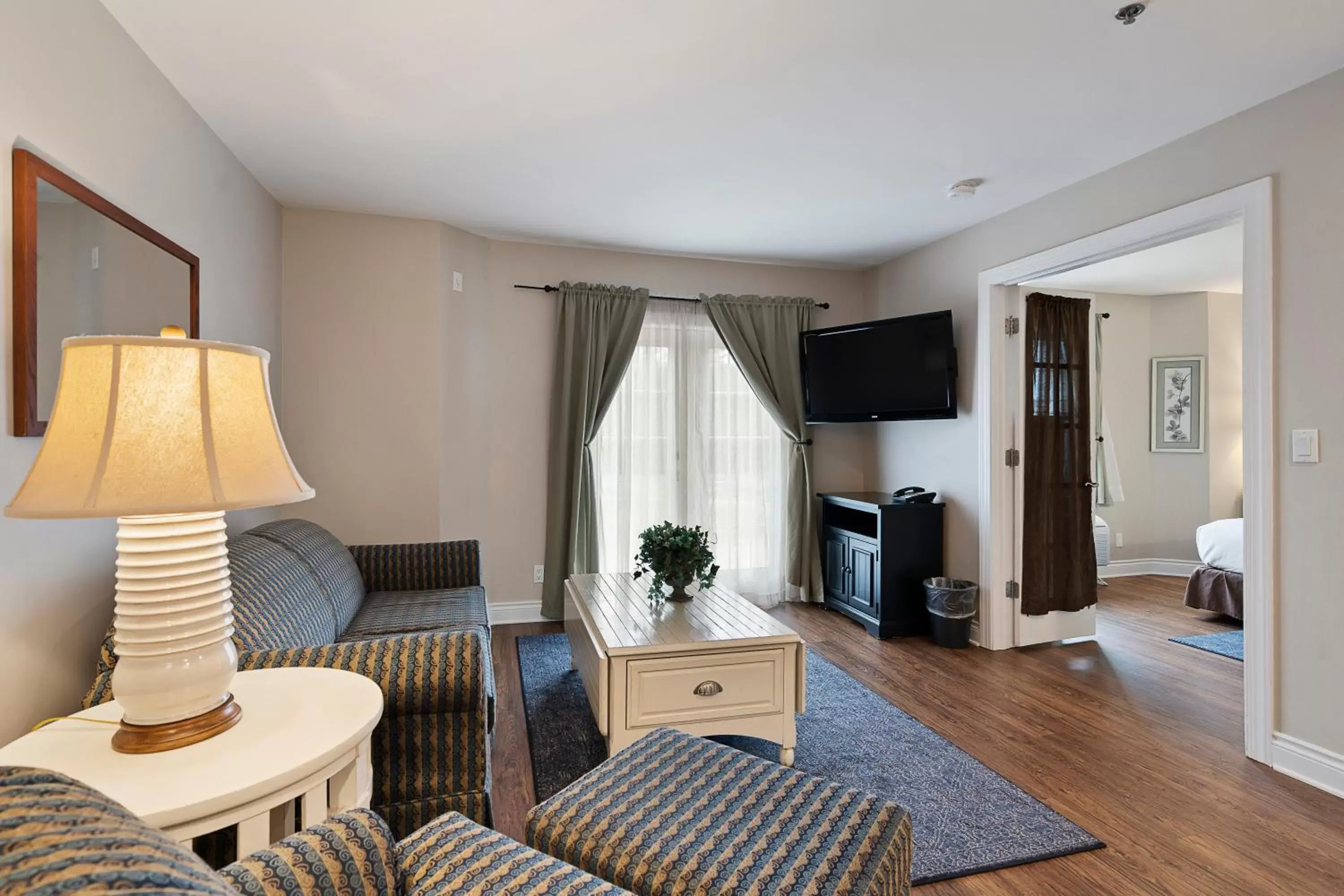 TV and multimedia, Seating Area in Charlevoix Inn & Suites SureStay Collection by Best Western