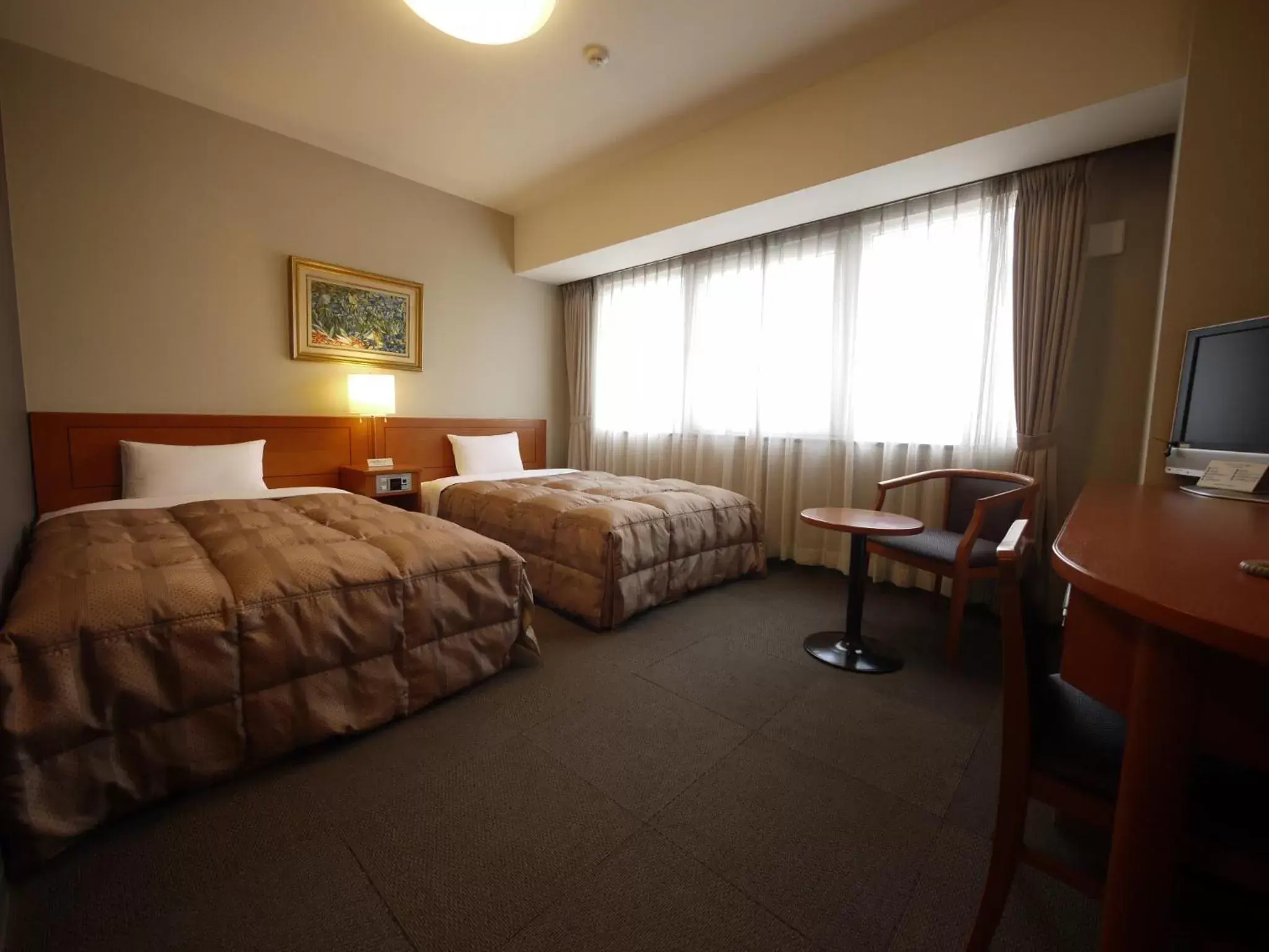 Photo of the whole room, Bed in Hotel Route-Inn Saga Ekimae