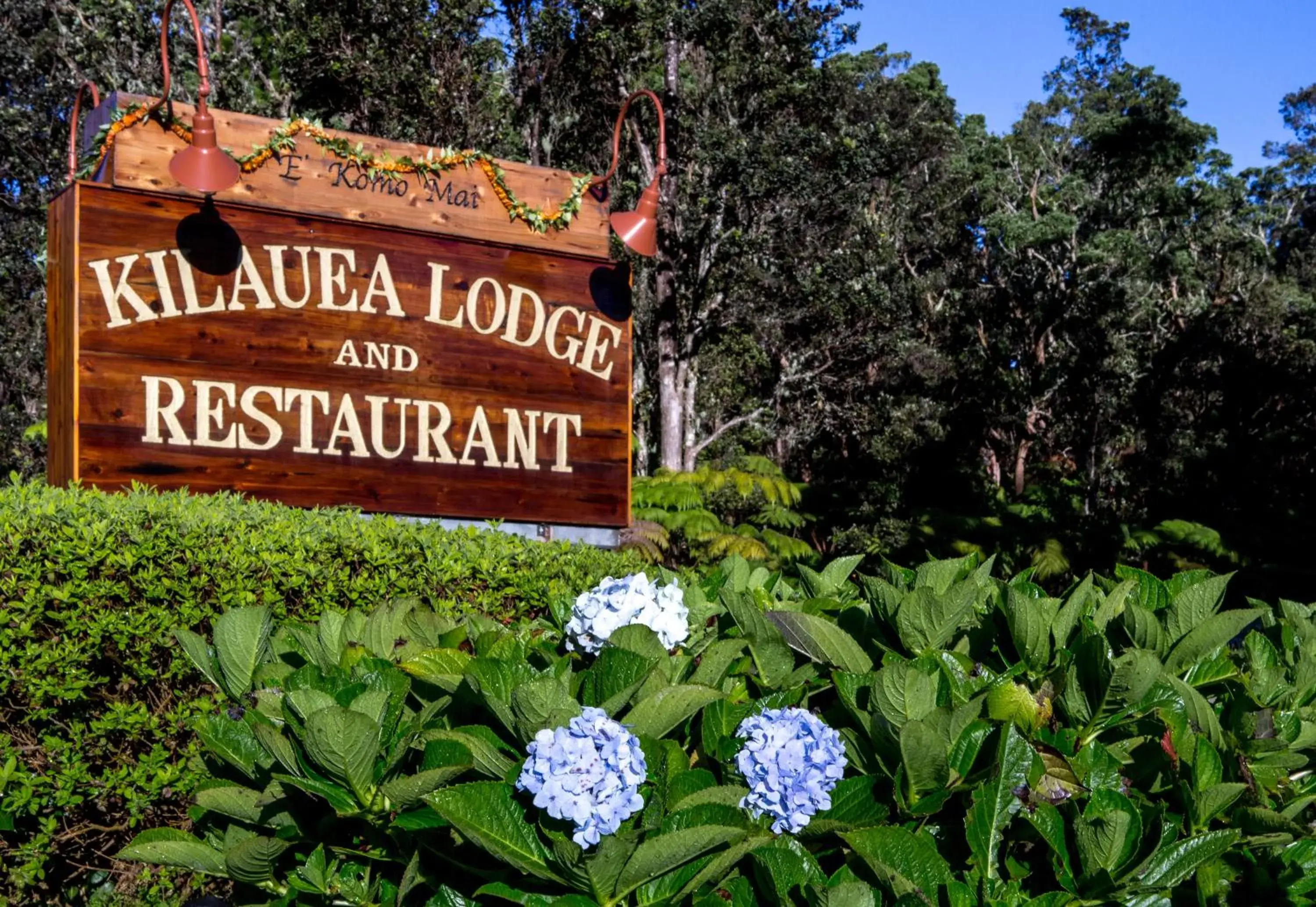Property logo or sign in Kilauea Lodge and Restaurant